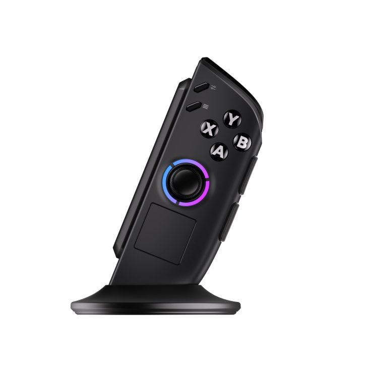 Black gaming controller with X Y A B buttons on a charging dock.
