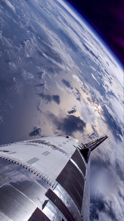 SpaceX Starship nose view above Earth.