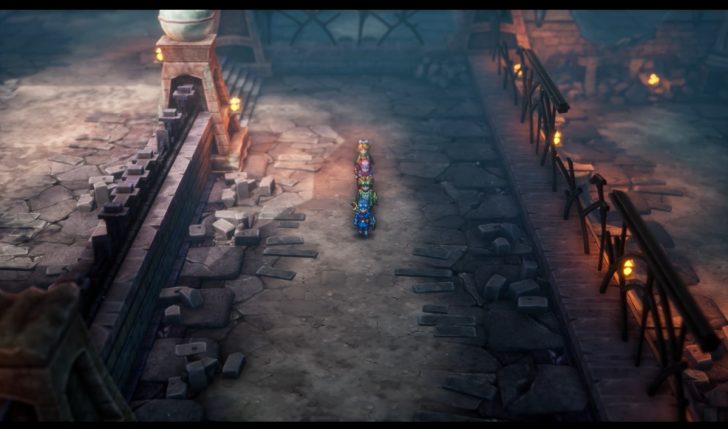 Video game characters walking through a medieval pathway with torches lit.