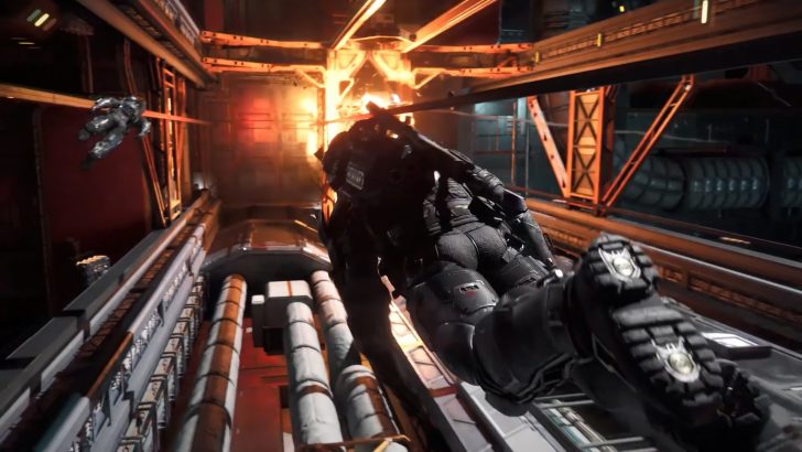 A character in space suit jumps through a fiery space station corridor.