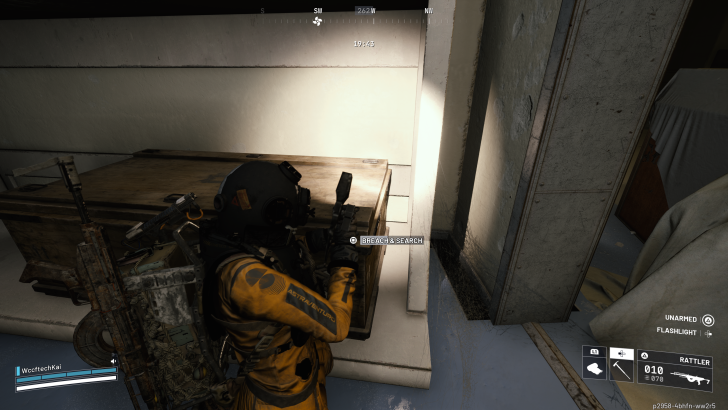 A character in a yellow and black suit labeled ASTRAVENTURPC prepares to 'BREACH & SEARCH' a wooden crate in a game interface, with WccftechKai player name and RATTLER weapon details visible on-screen.