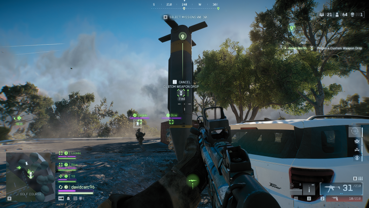 A first-person view in Battlefield 2042 shows a player near a large supply crate labeled 'Custom Weapon Drop,' with teammates indicated on-screen and a map in the bottom left corner.
