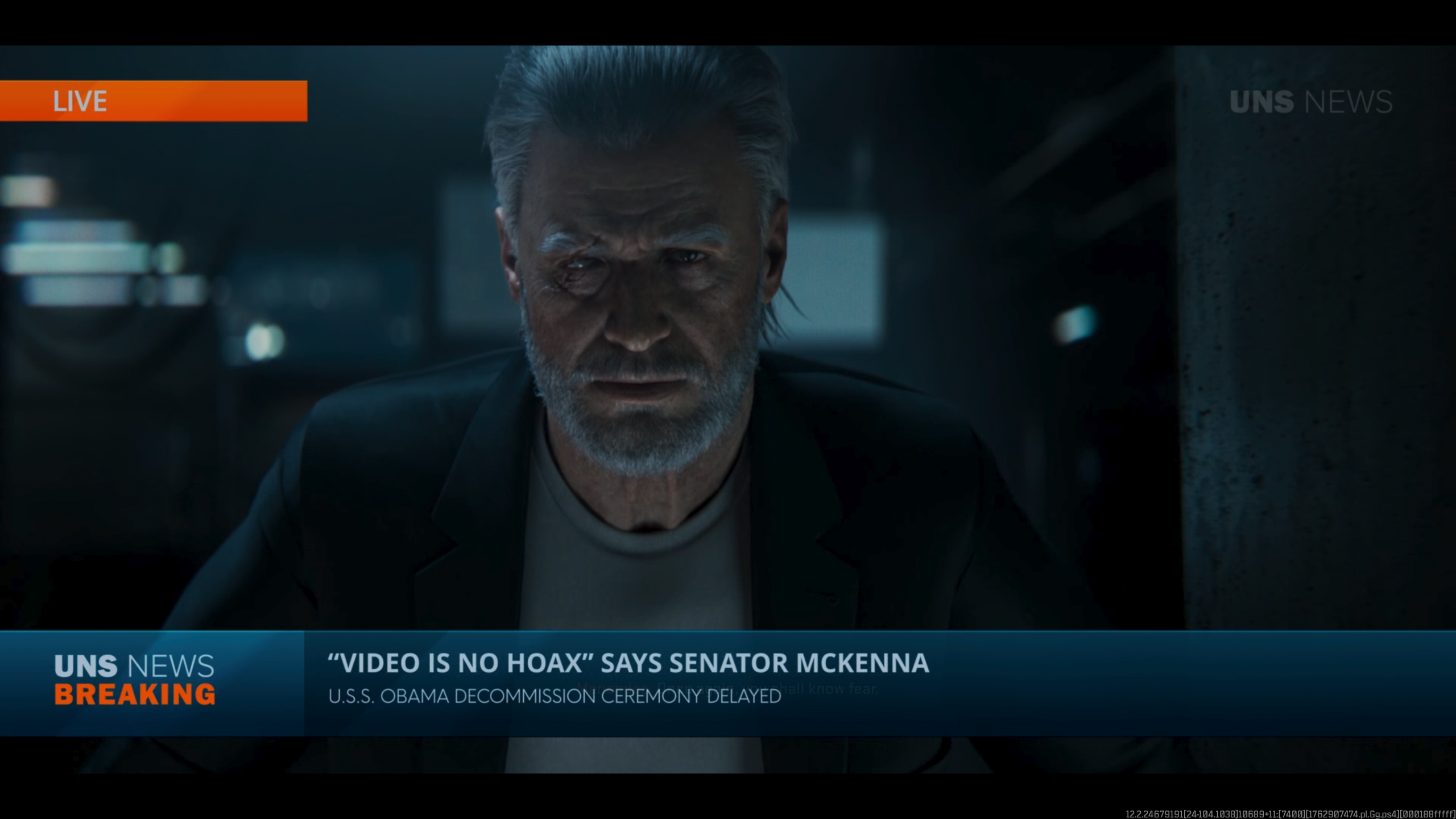 A character in a video game cutscene is shown on 'UNS News Breaking' with a headline, “‘Video is no hoax’ says Senator McKenna, U.S.S. Obama decommission ceremony delayed.”