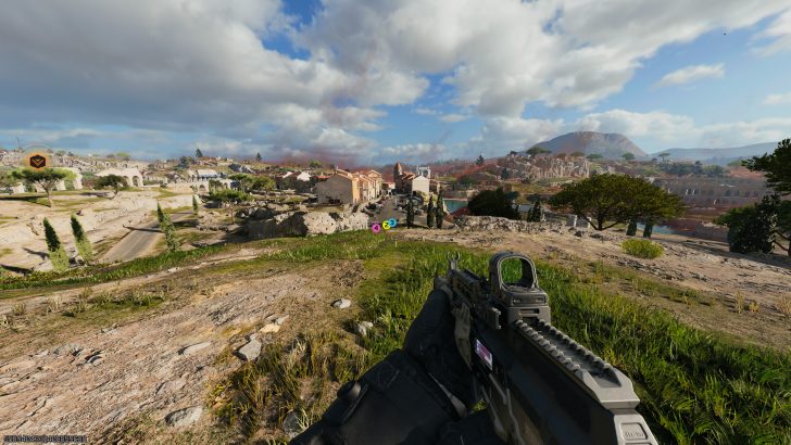 A first-person view in the game 'Call of Duty: Modern Warfare III' shows a player holding a rifle while overlooking a detailed landscape with buildings and trees in the distance.