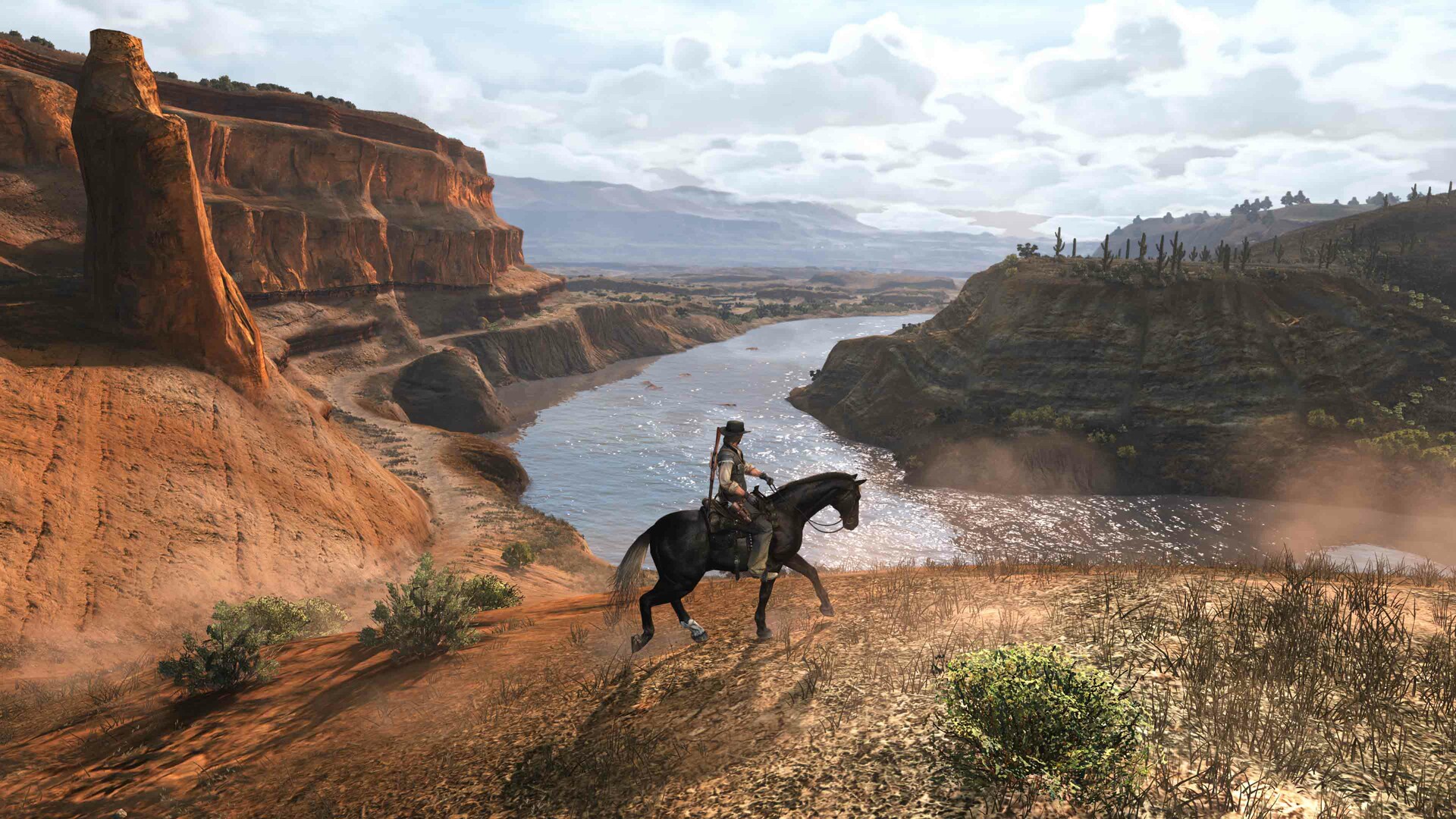 A character on horseback exploring a canyon landscape in the game 'Red Dead Redemption.'