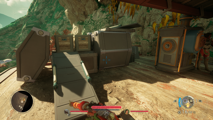 Video game interface showing a character on a wooden deck with large machinery and a control panel with LB and RB buttons visible.