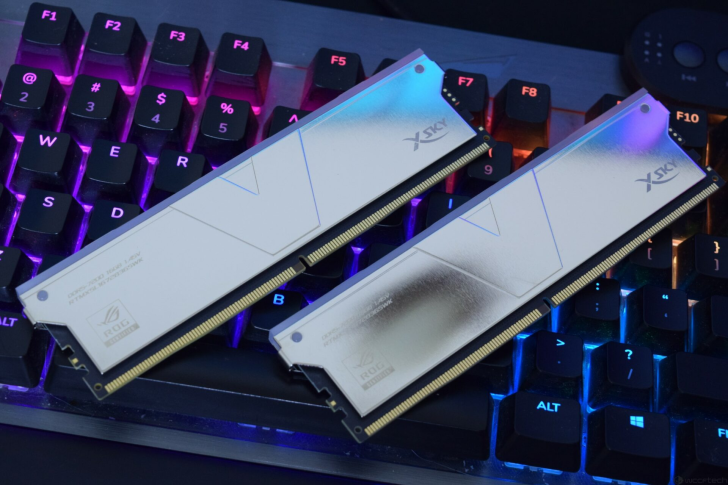 Two XSKY brand memory modules with ROG insignia placed on a colorful RGB-lit keyboard.
