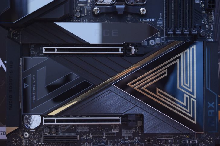 A motherboard featuring the MSI logo with visible PCIe slots, heat sinks labeled 'HDMI' and 'PUSH AND LIFT,' and decorative elements in metallic gold.
