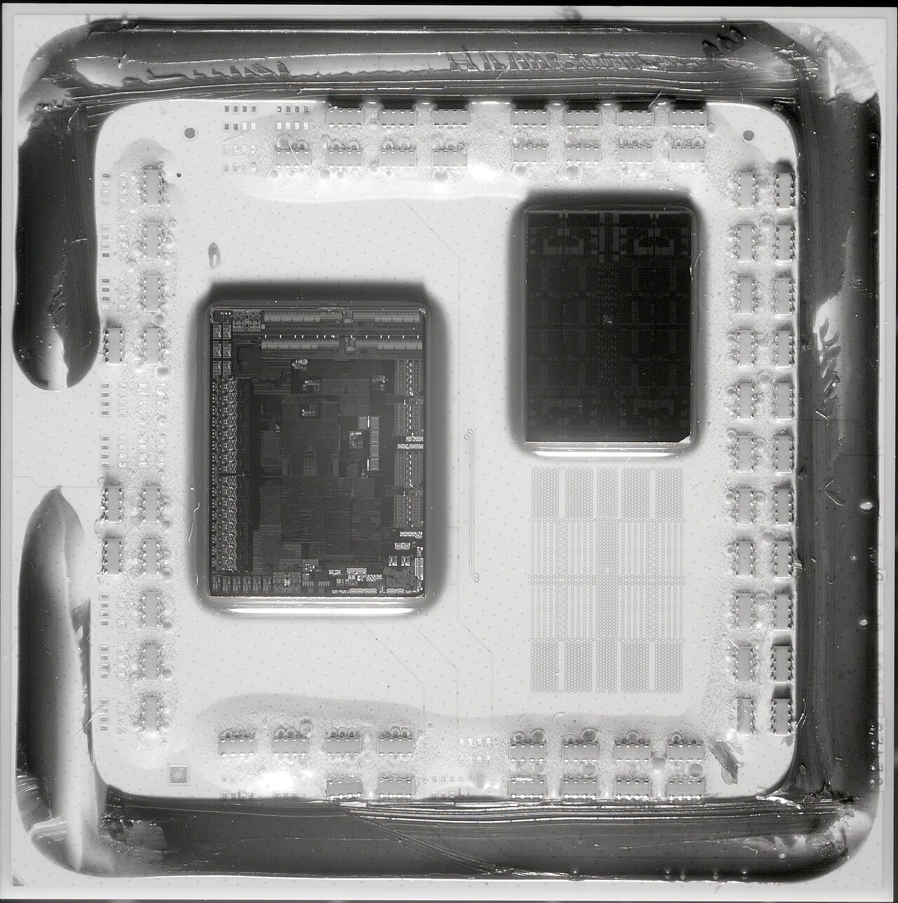 A close-up view of the internal components of a semiconductor chip, showing intricate circuitry and multiple layered structures.