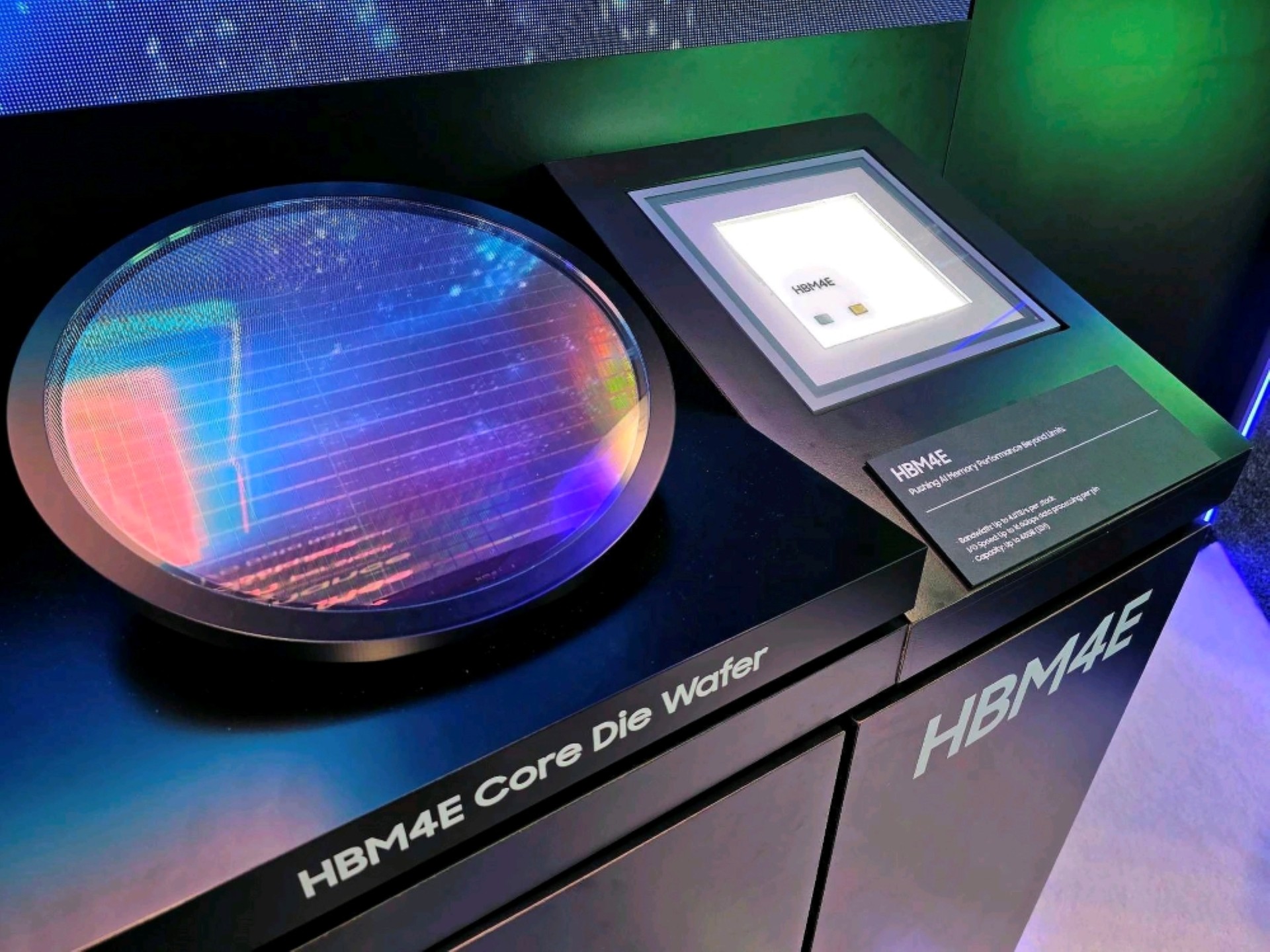 An HBM4E core die wafer is displayed next to a sign reading 'HBM4E: Raising Memory Performance.'