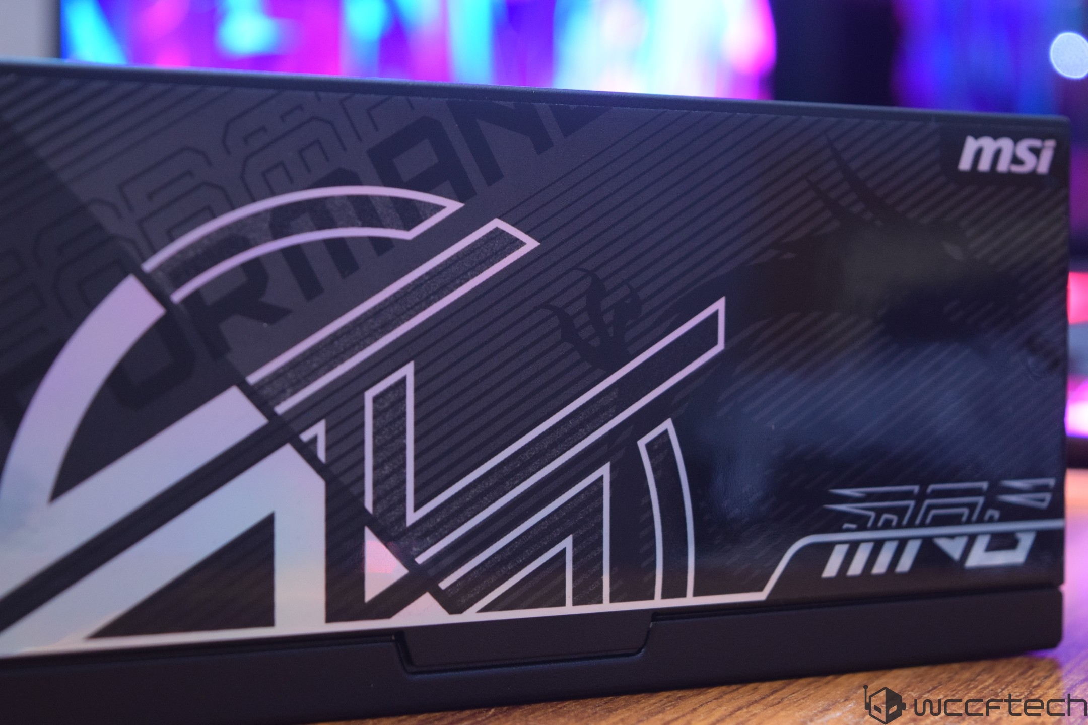 A close-up of an MSI graphics card box with a black and white design featuring geometric patterns and the MSI logo in the corner.