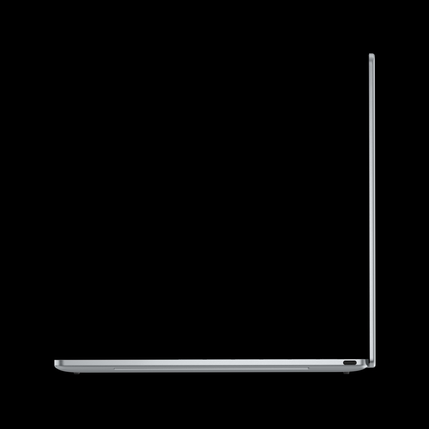 A side profile view of an unbranded thin silver laptop with a closed hinge, showing the thinness of the device against a black background.