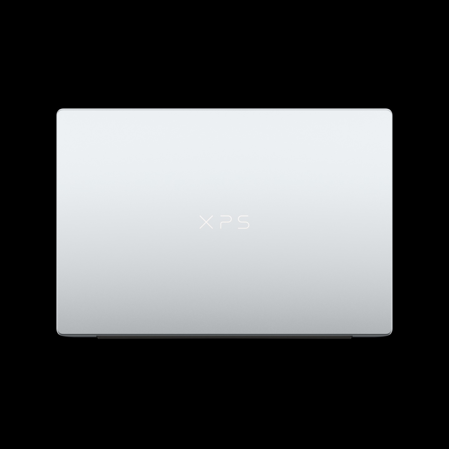A Dell XPS laptop viewed from the top with the 'XPS' logo prominently displayed on the lid.