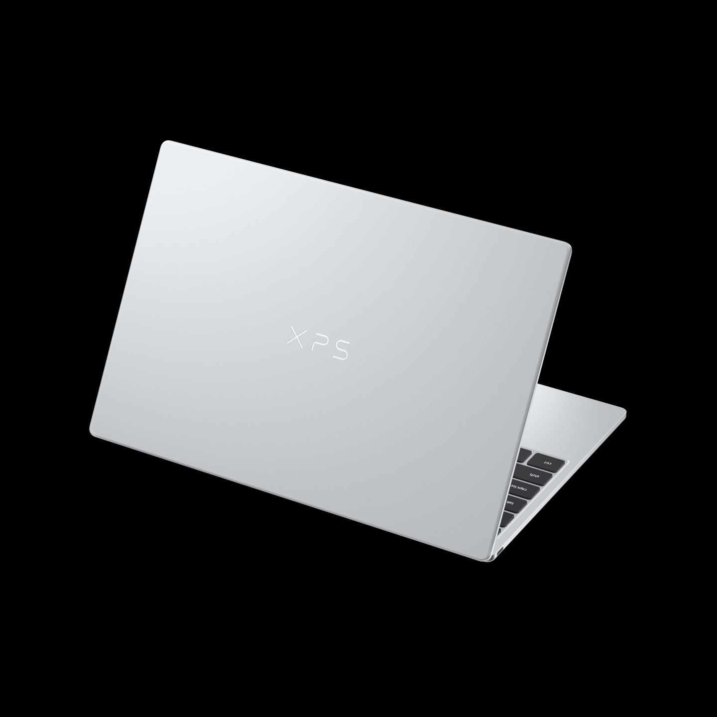 A silver Dell XPS laptop with the lid partially open against a black background.