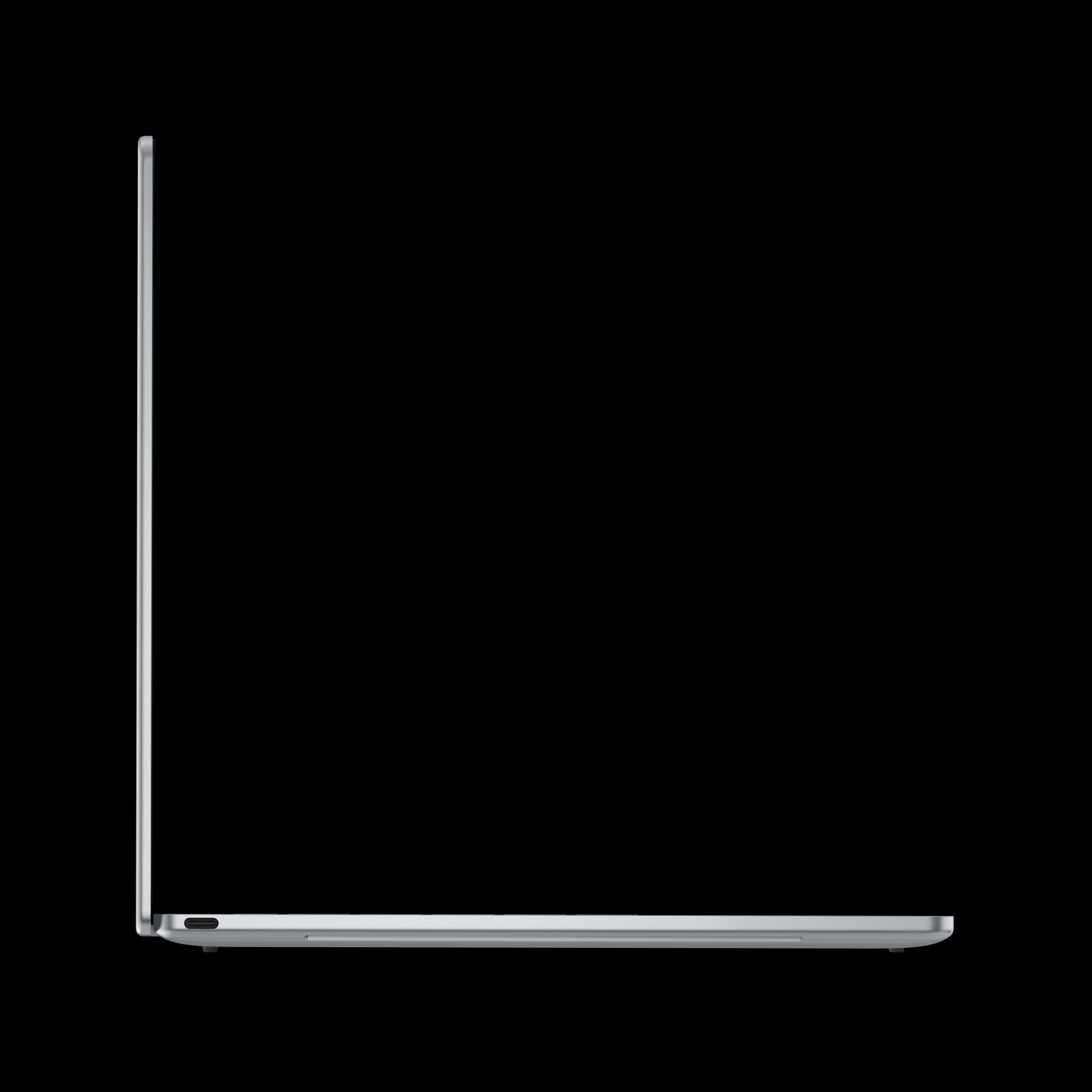 A side view of an unbranded slim silver laptop lid partially open against a black background.