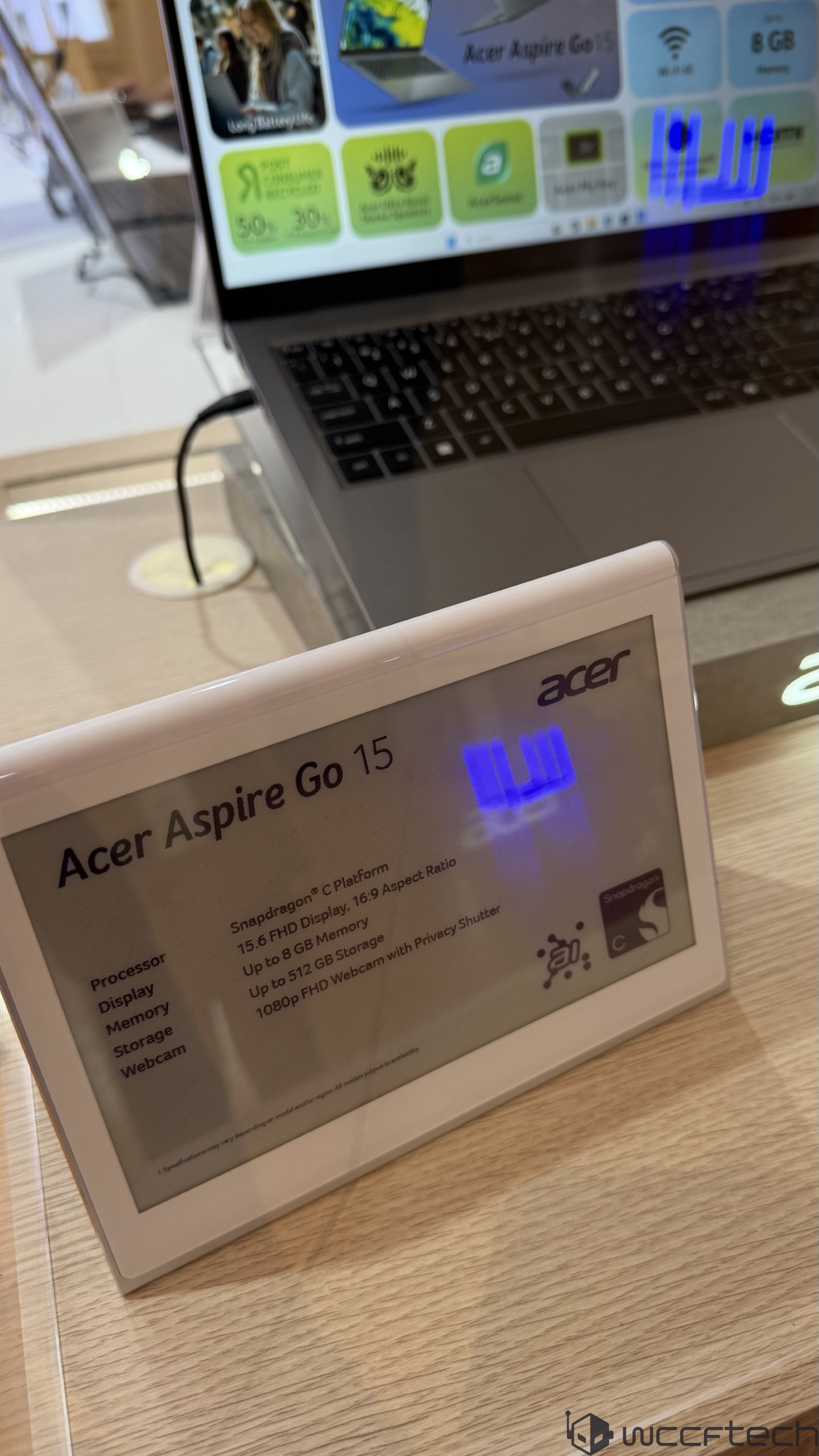 A display next to a laptop describes the Acer Aspire Go 15 with a Snapdragon C platform, a 15.6 FHD display, up to 8 GB memory, up to 512 GB storage, and a 1080p FHD webcam with a privacy shutter.