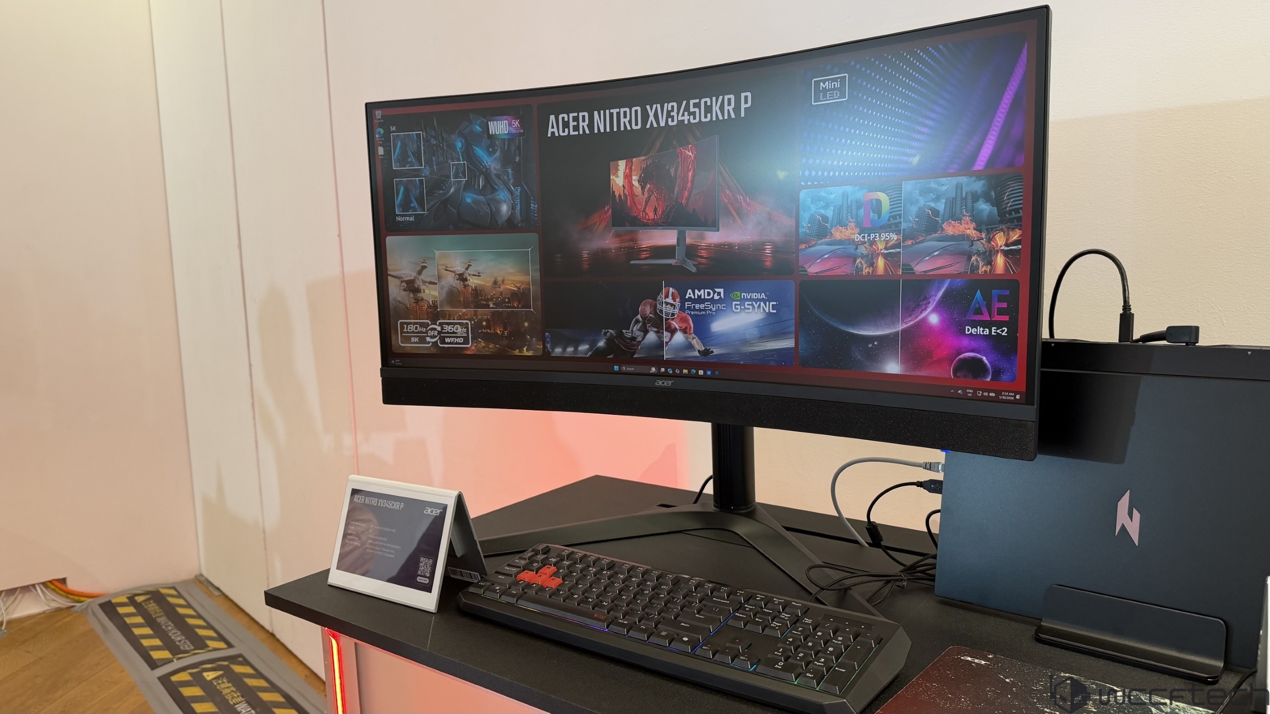 An Acer Nitro XV345CKR P monitor is displayed, featuring 'AMD FreeSync Premium Pro,' 'NVIDIA G-SYNC,' and specifications like '5K' resolution and '360 Hz WQHD.'