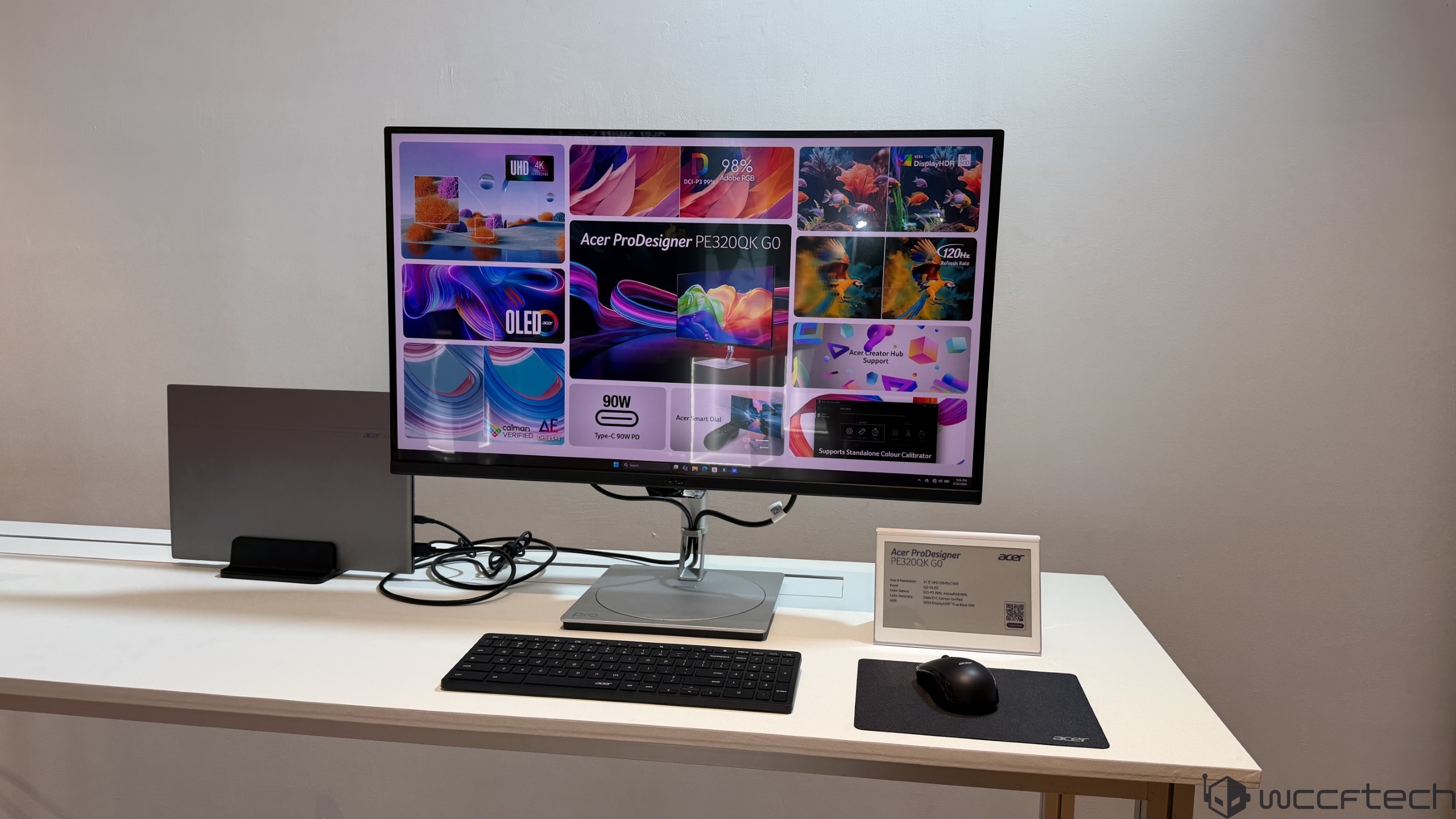 Acer ProDesigner PE320QK G0 monitor on display, featuring 'UHD 4K' resolution, with a connected keyboard and mouse on a desk setup.