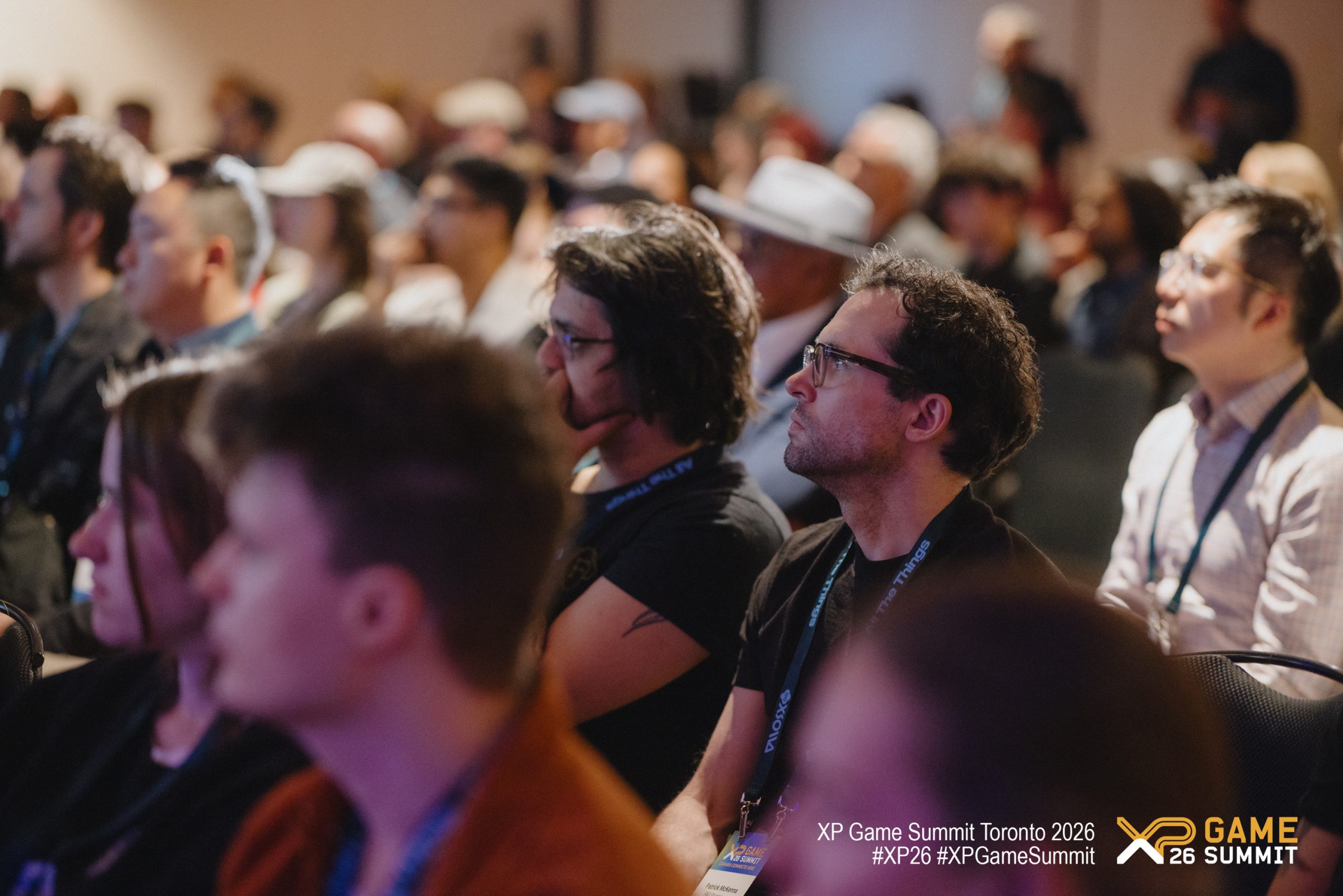 An audience attentively listening at the XP Game Summit Toronto 2026, with visible text reading 'XP Game Summit.'