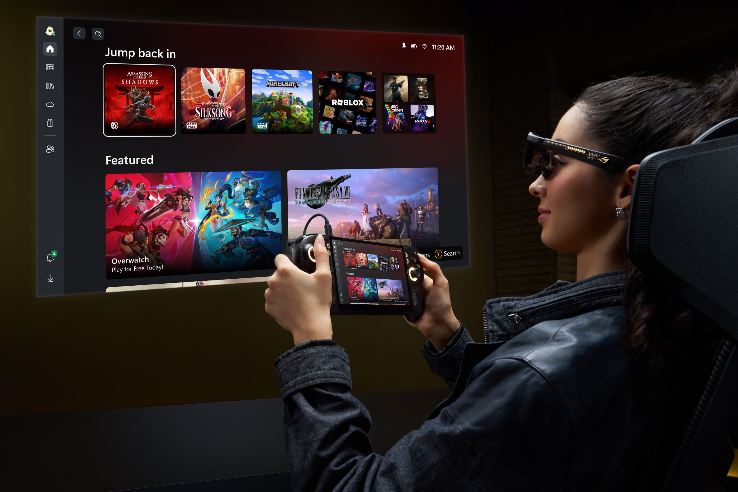A person wearing augmented reality glasses holds a handheld device displaying a gaming interface featuring games like 'Assassin's Creed: Shadows,' 'Silksong,' and 'Overwatch,' with a projection of the same screen ahead.