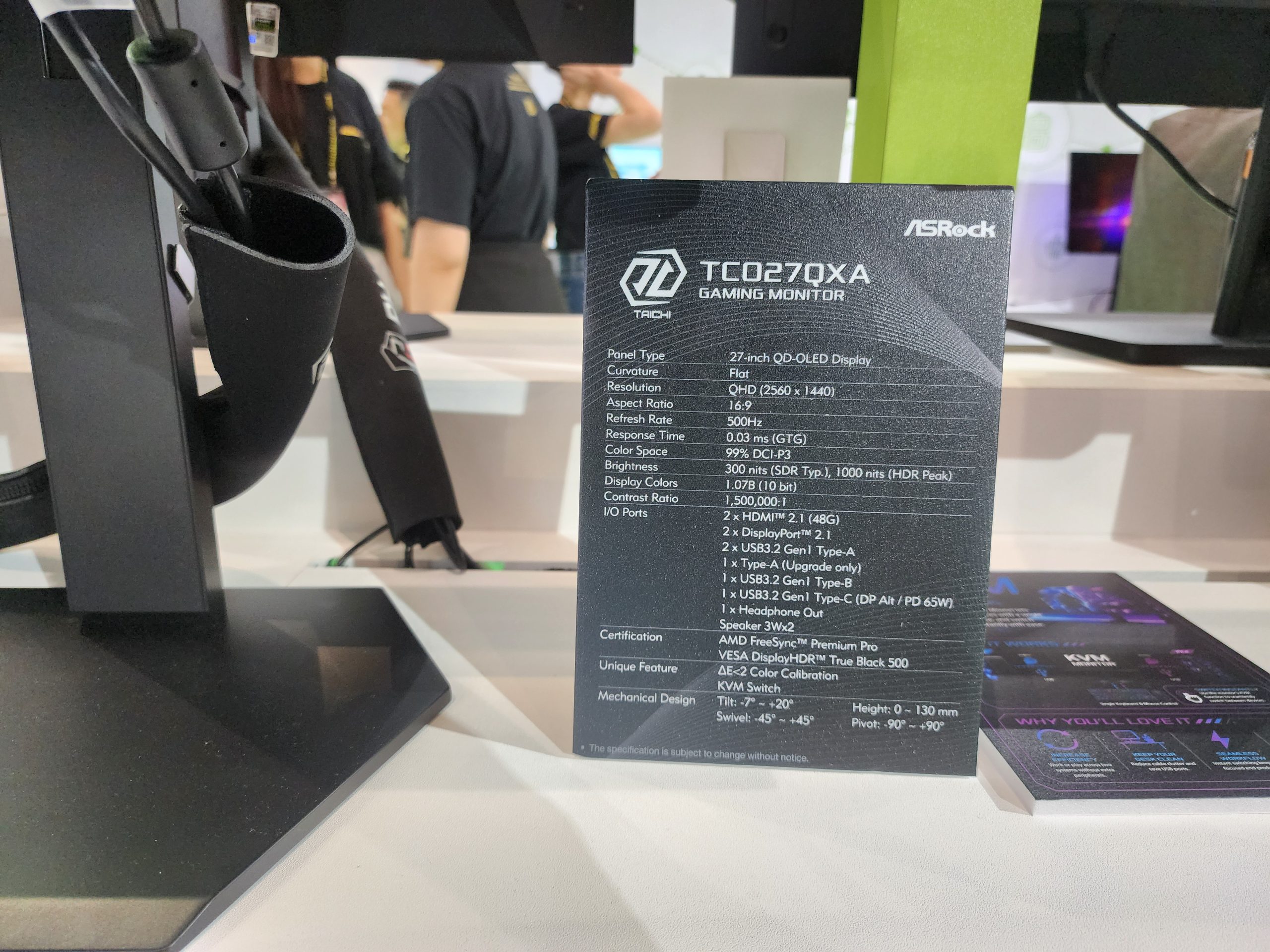 An ASRock TC0270XA gaming monitor spec sheet displaying features such as a 27-inch QHD OLED display, 16:9 aspect ratio, 500Hz refresh rate, 0.03 ms (GTG) response time, and 1000 nits brightness (HDR Peak).