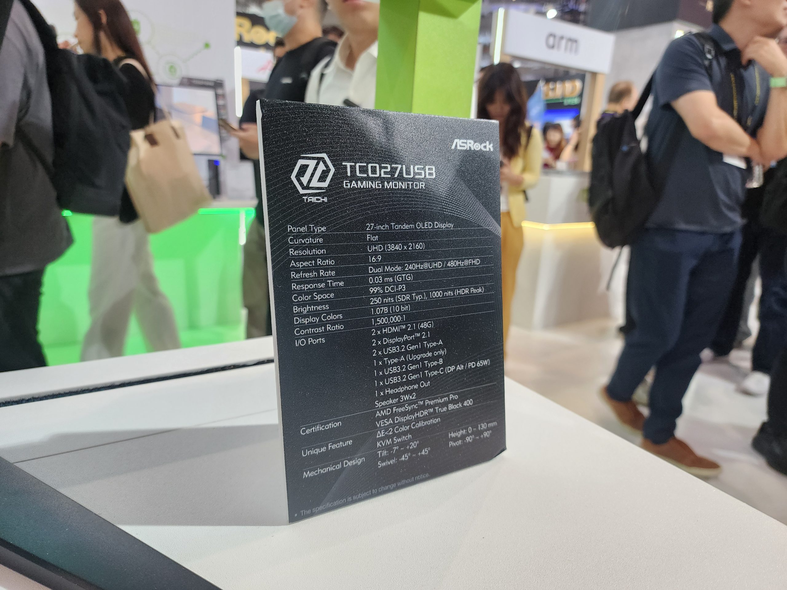 An ASRock TC027U5B gaming monitor information card listing specifications such as a 27-inch OLED display, UHD 3840 x 2160 resolution, and 240Hz/480Hz refresh rate.