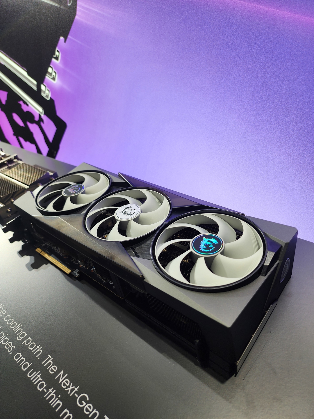 An MSI graphics card with triple fans is displayed on a black surface with part of the text reading 'The Next-Gen.'