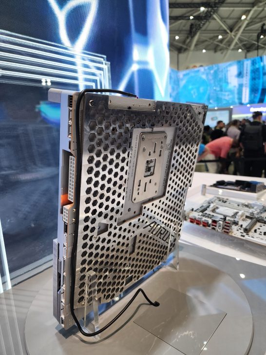 A prototype of the ASUS AirFort Flow PC case with a honeycomb design is displayed at a technology exhibition.