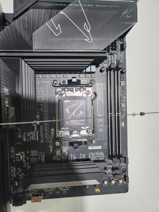 Close-up of a Gigabyte Z790 Aorus Tachyon motherboard showing the CPU socket and DDR5 RAM slots.
