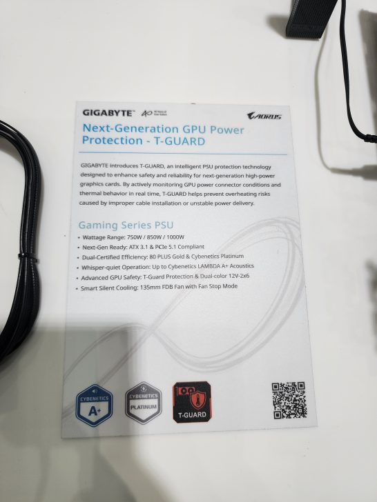 A presentation slide titled 'Next-Generation GPU Power Protection - T-GUARD' from Gigabyte outlines features of a Gaming Series PSU with wattage range 750W/850W/1000W, dual-certified efficiency, and advanced GPU safety measures.