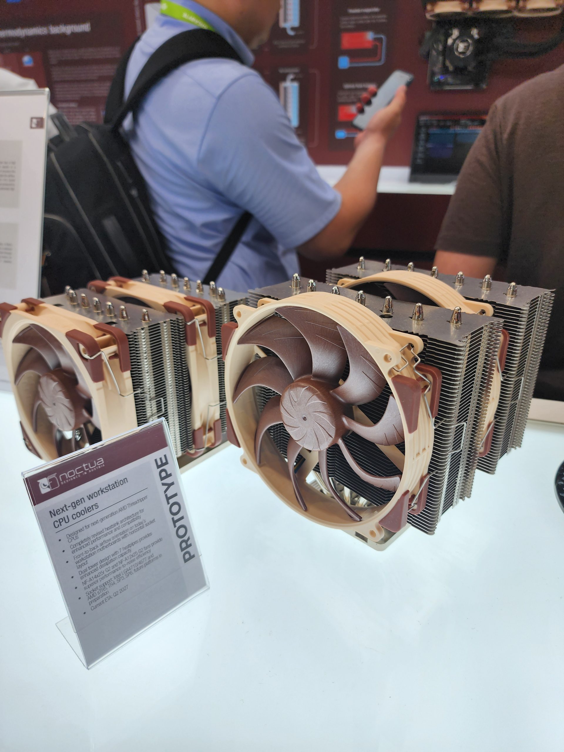 A display of Noctua next-gen workstation CPU coolers labeled as 'PROTOTYPE' with detailed specifications listed on a sign.