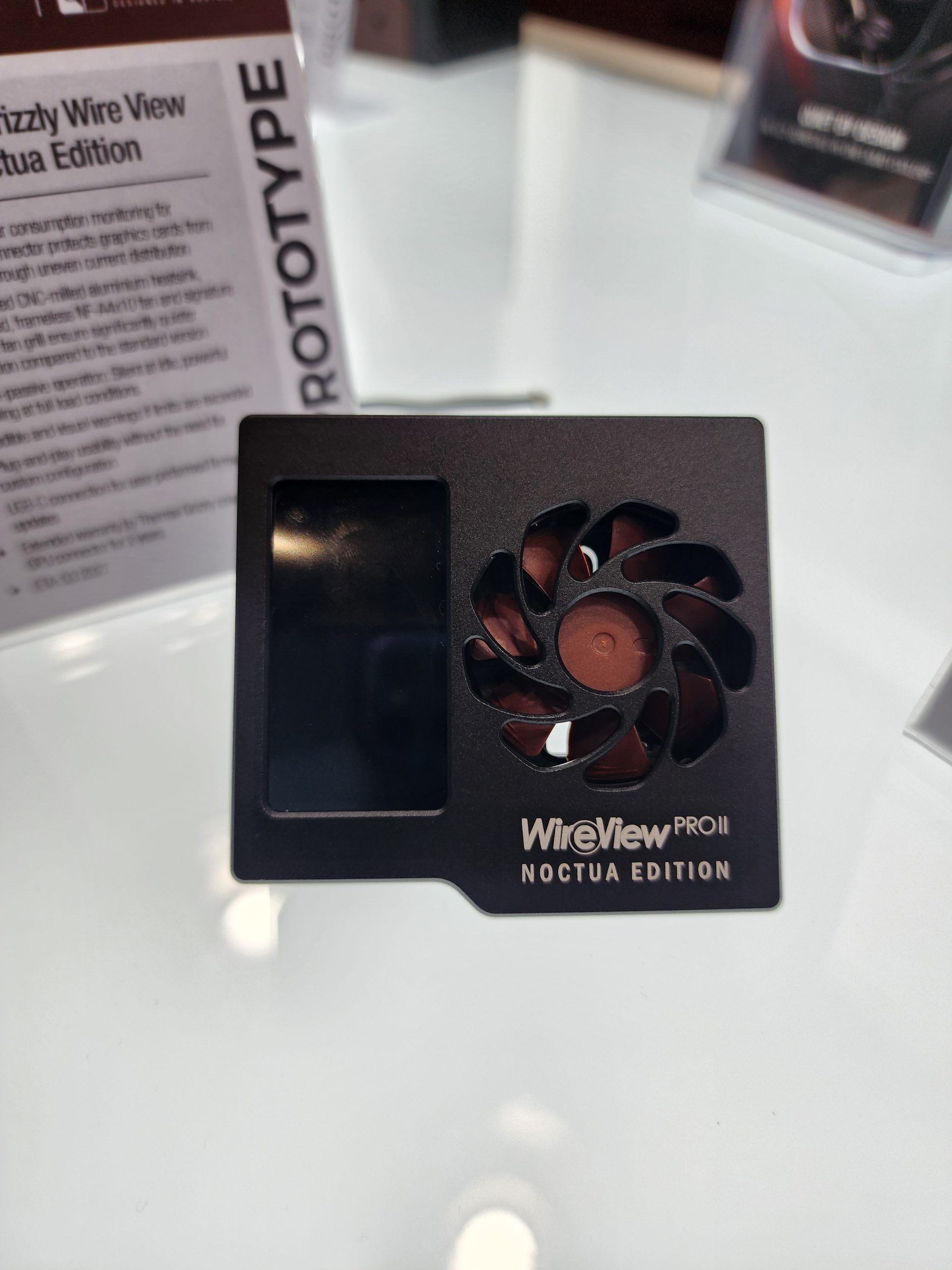 A WireView PRO II Noctua Edition prototype with an integrated fan and display is shown on a reflective surface.