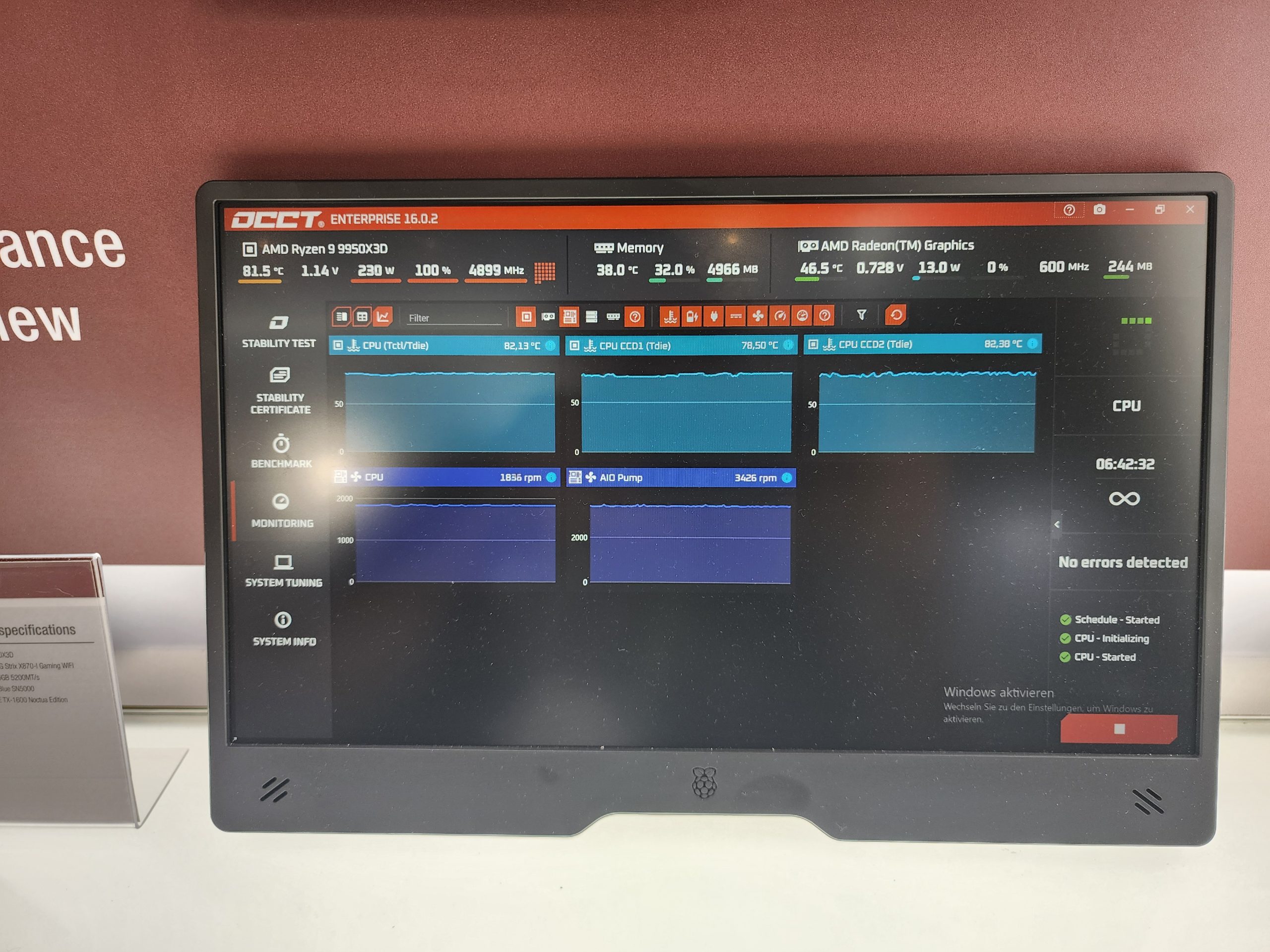 A monitor displays OCCT Enterprise 16.0.2 software showing stability test graphs for an AMD Ryzen 9 9950X3D CPU with specifications such as 81.5°C temperature, 1.14V voltage, and 4899 MHz frequency, alongside AMD Radeon Graphics details.