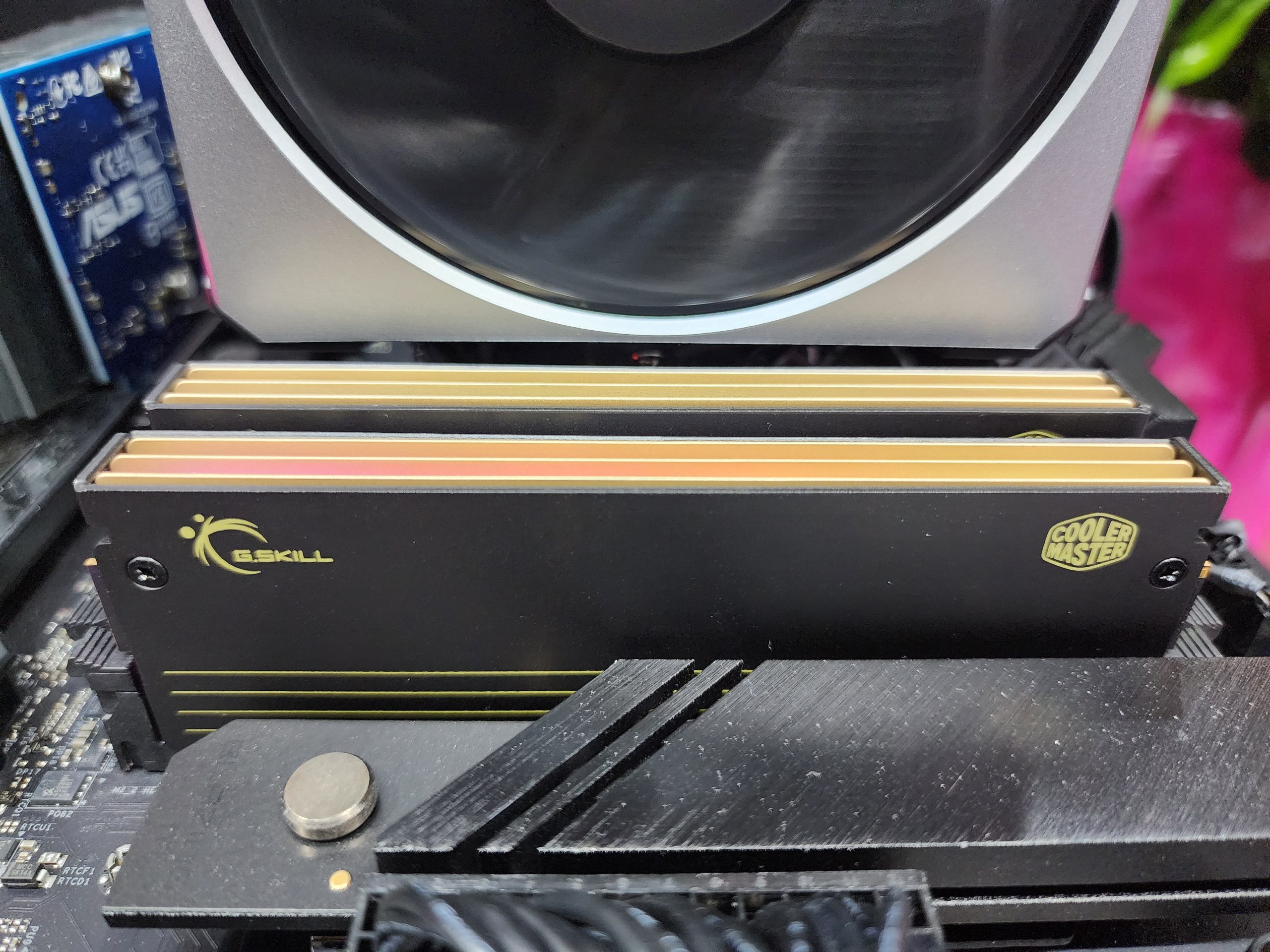 G.Skill RAM modules with a Cooler Master heatsink are installed on a motherboard.