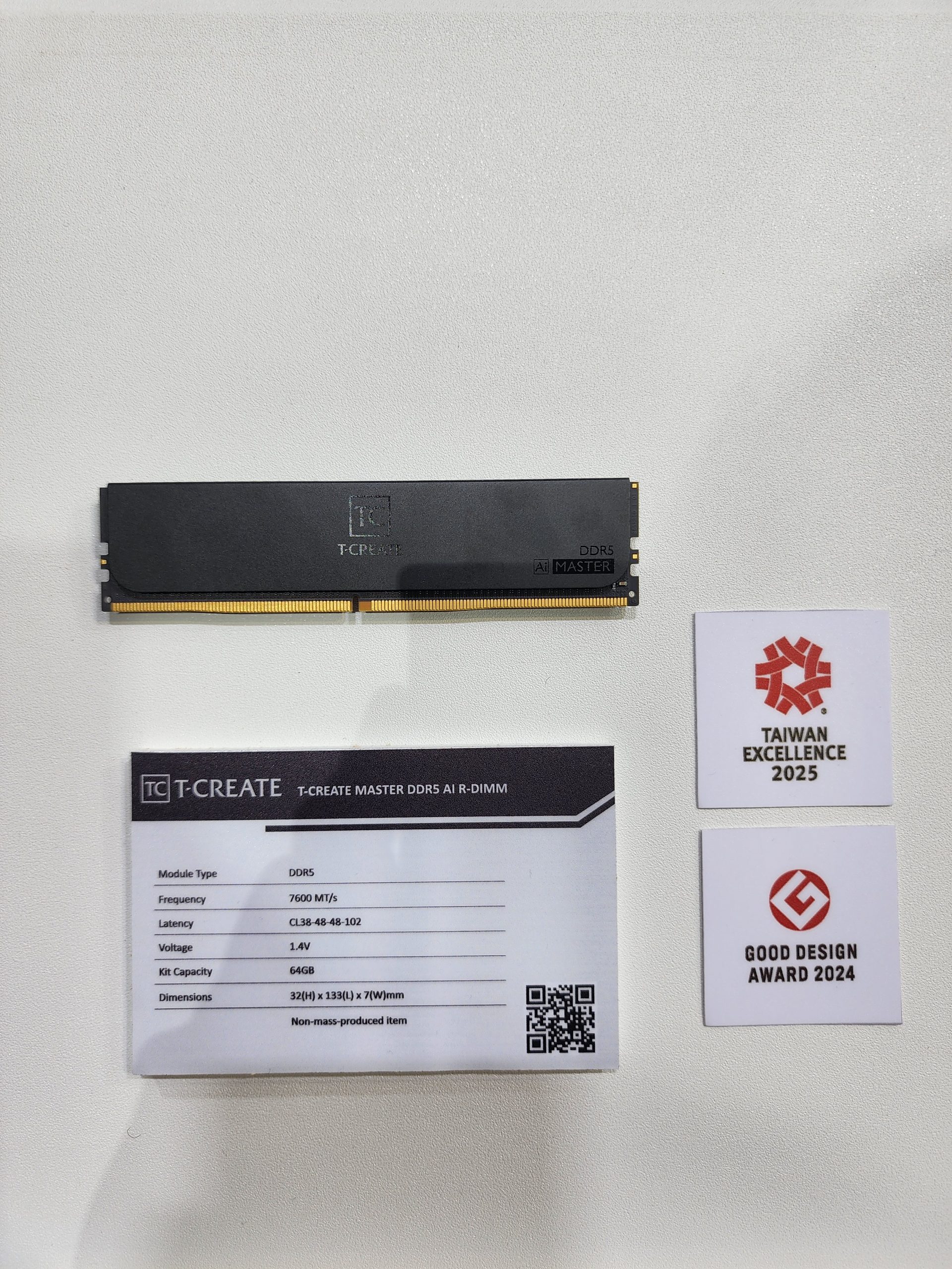 A T-CREATE Master DDR5 AI R-DIMM memory module is displayed with a specification card detailing a frequency of 7600 MT/s and 64GB kit capacity, alongside badges for 'Taiwan Excellence 2025' and 'Good Design Award 2024'.