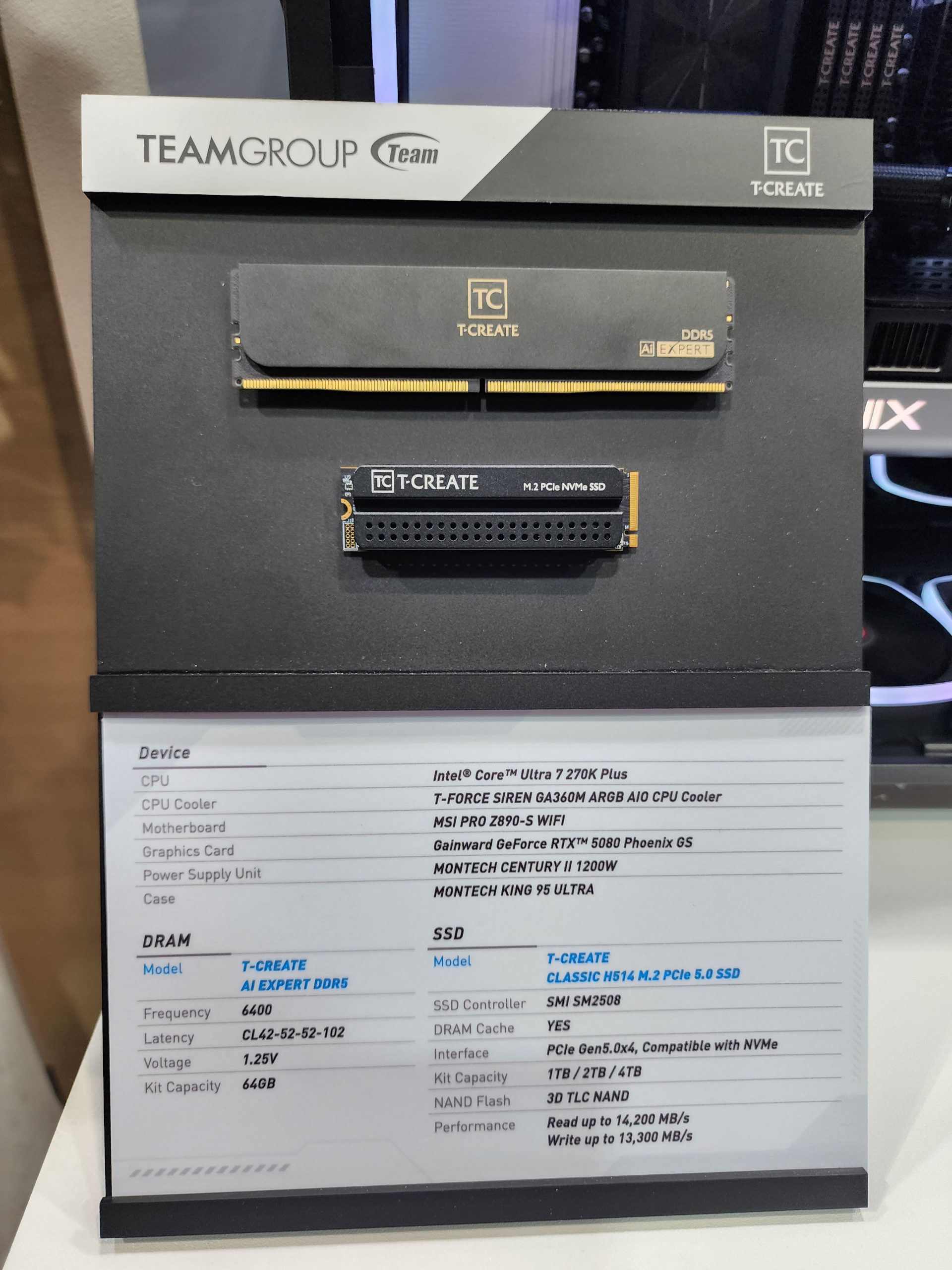 A display showcasing TeamGroup T-Create AI Expert DDR5 RAM and T-Create Classic H514 M.2 PCIe 5.0 SSD, with detailed specifications including an Intel Core Ultra 7 270K Plus CPU and Gainward GeForce RTX 5080 Phoenix GS GPU.