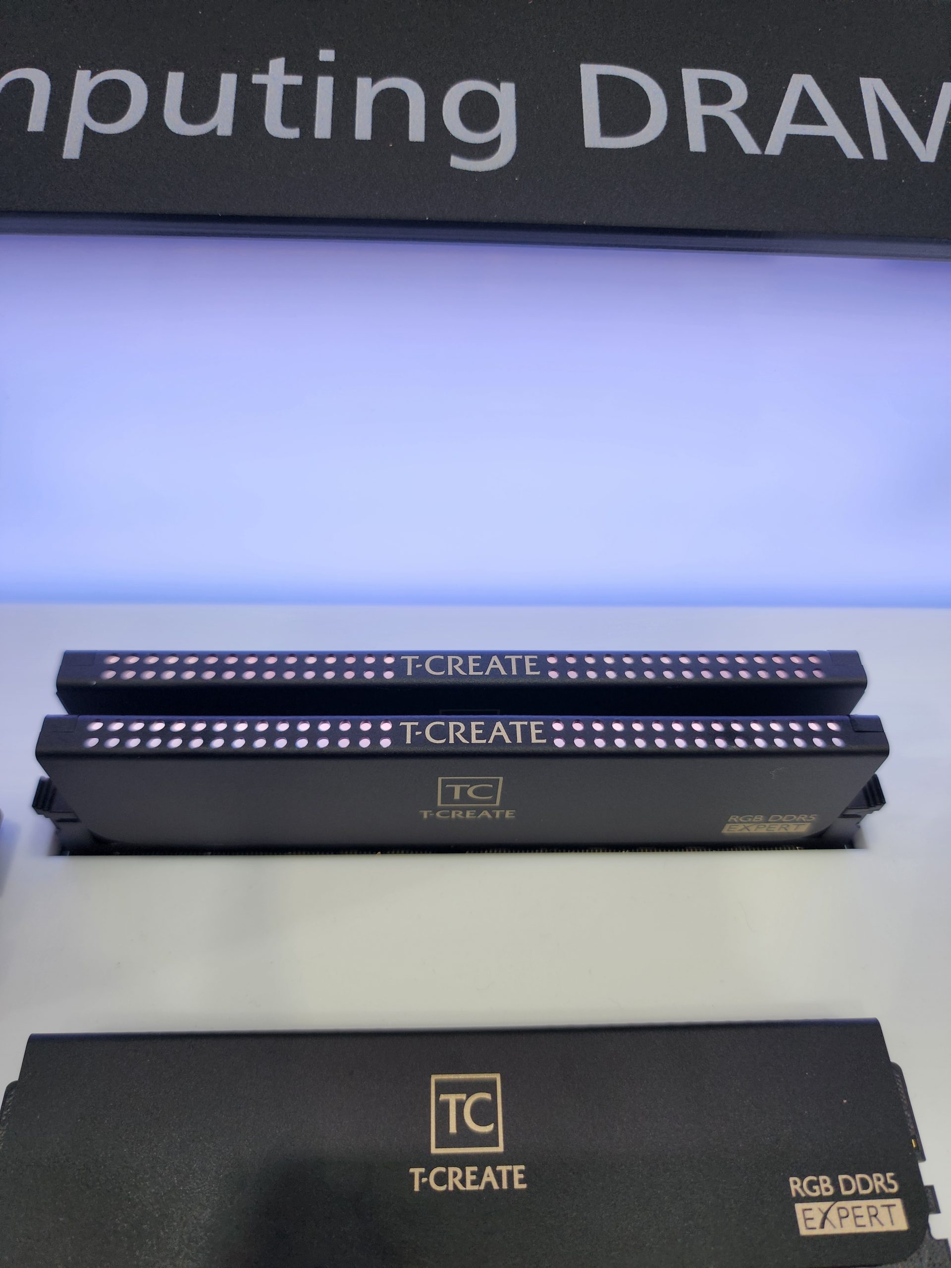 T-CREATE RGB DDR5 Expert memory modules are displayed with illuminated lighting and branding.