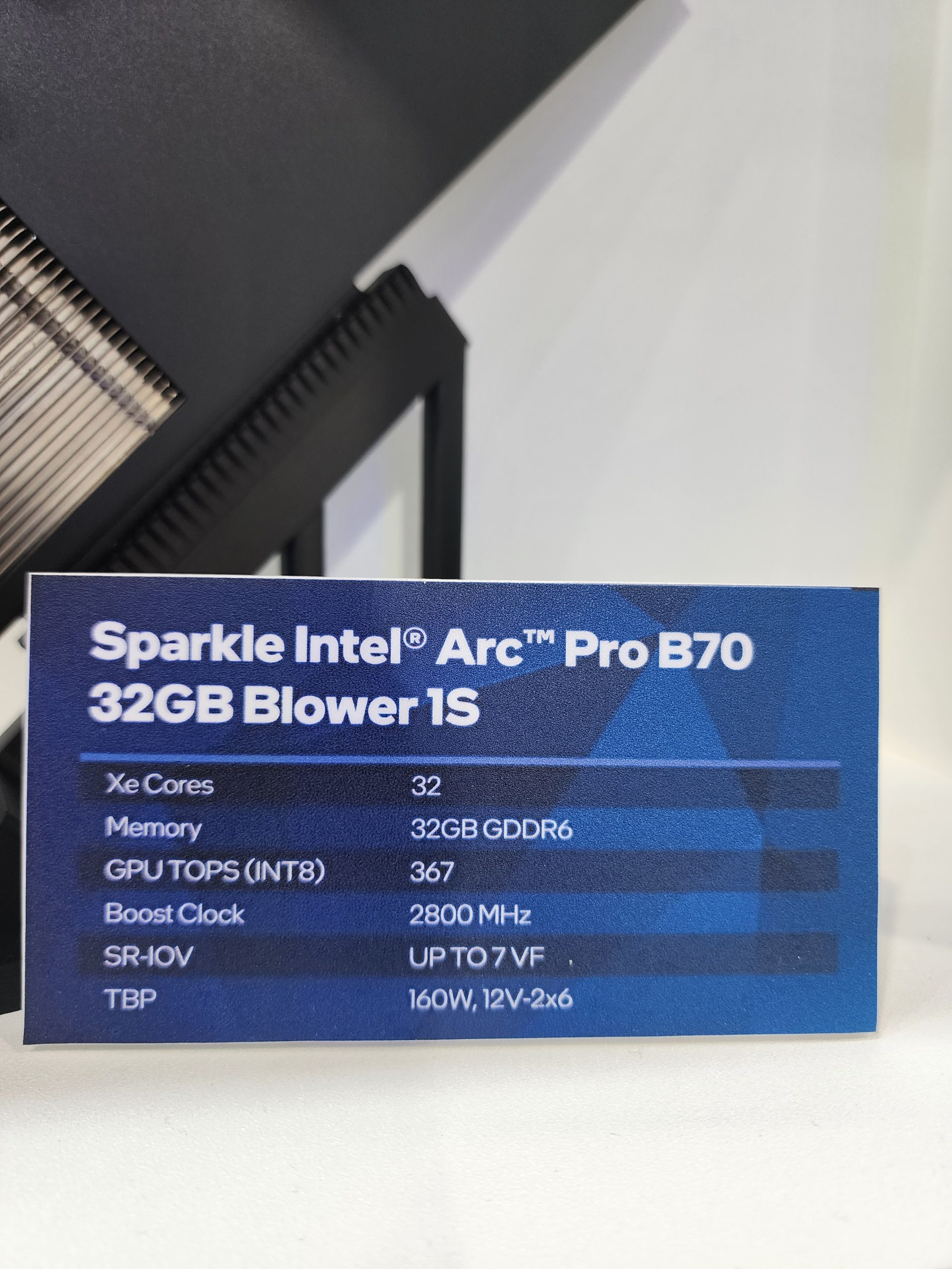 A Sparkle Intel Arc Pro B70 32GB Blower 1S specs card shows 32 Xe Cores, 32GB GDDR6 memory, GPU TOPS (INT8) of 367, a boost clock of 2800 MHz, SR-IOV with up to 7 VF, and a TBP of 160W, 12V-2x6.