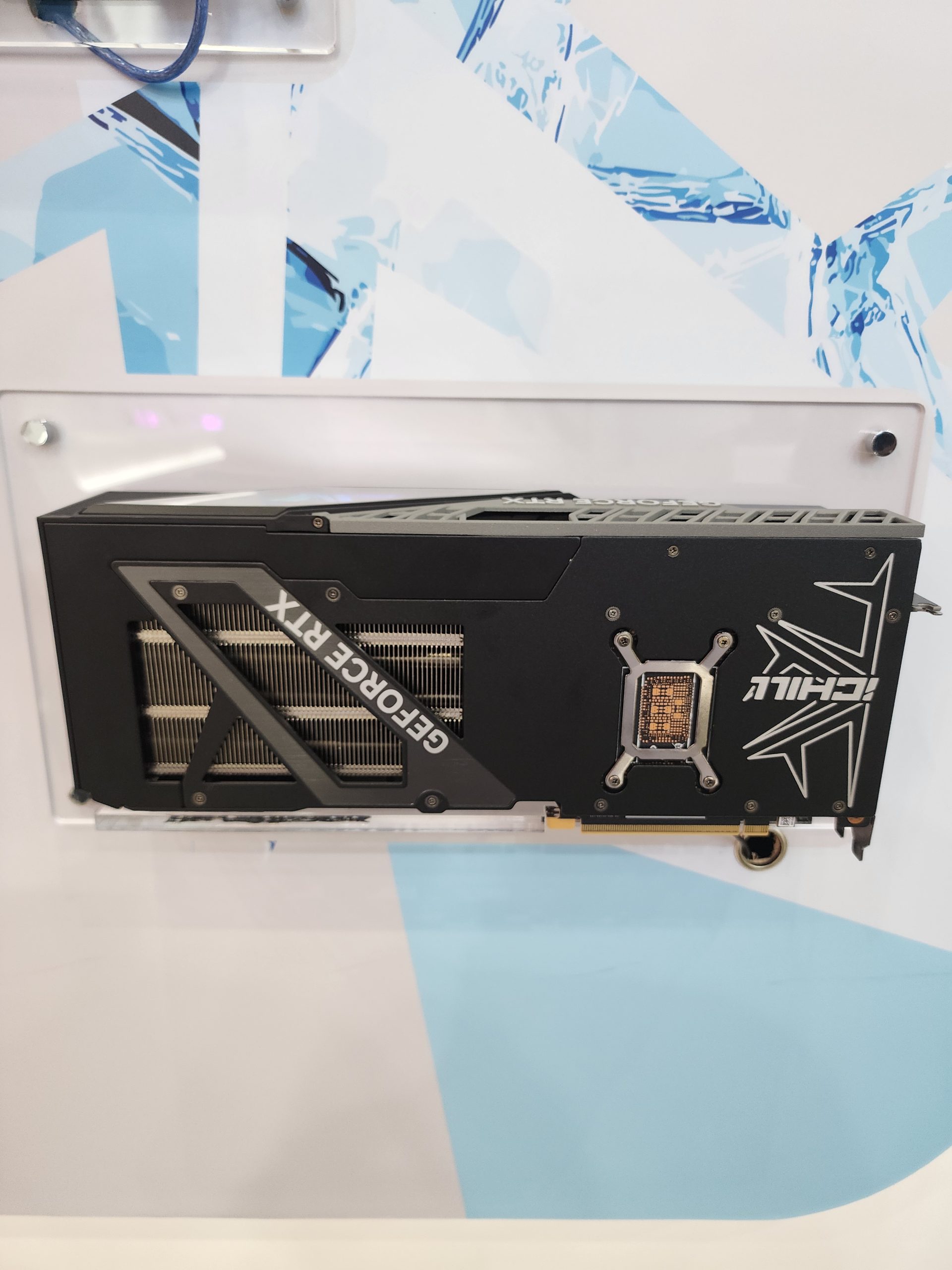 An iCHILL GeForce RTX graphics card is displayed against a geometric blue and white background.