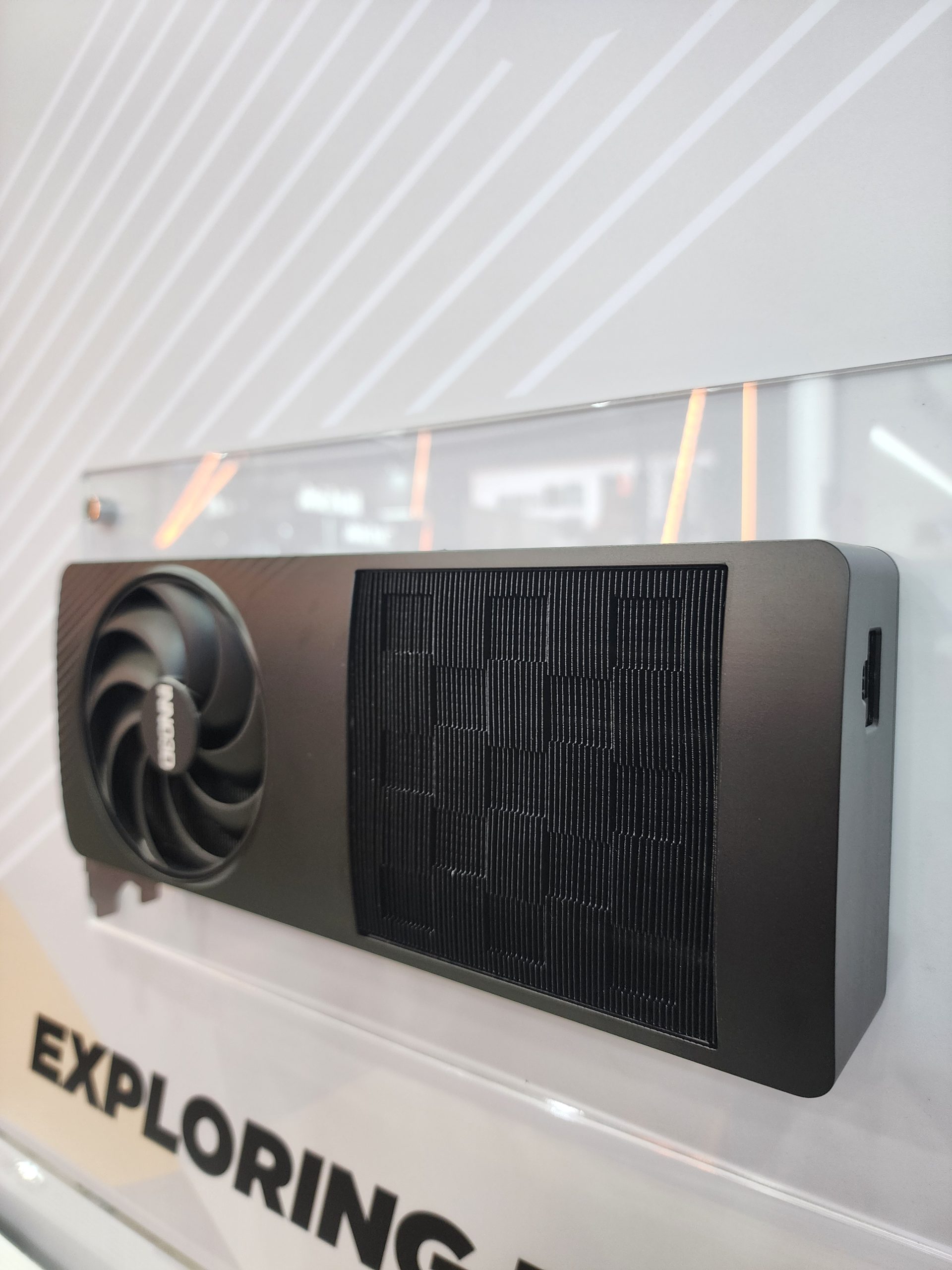 A panel-mounted 3dfx graphics card with a single fan is displayed above the text 'EXPLORING'.