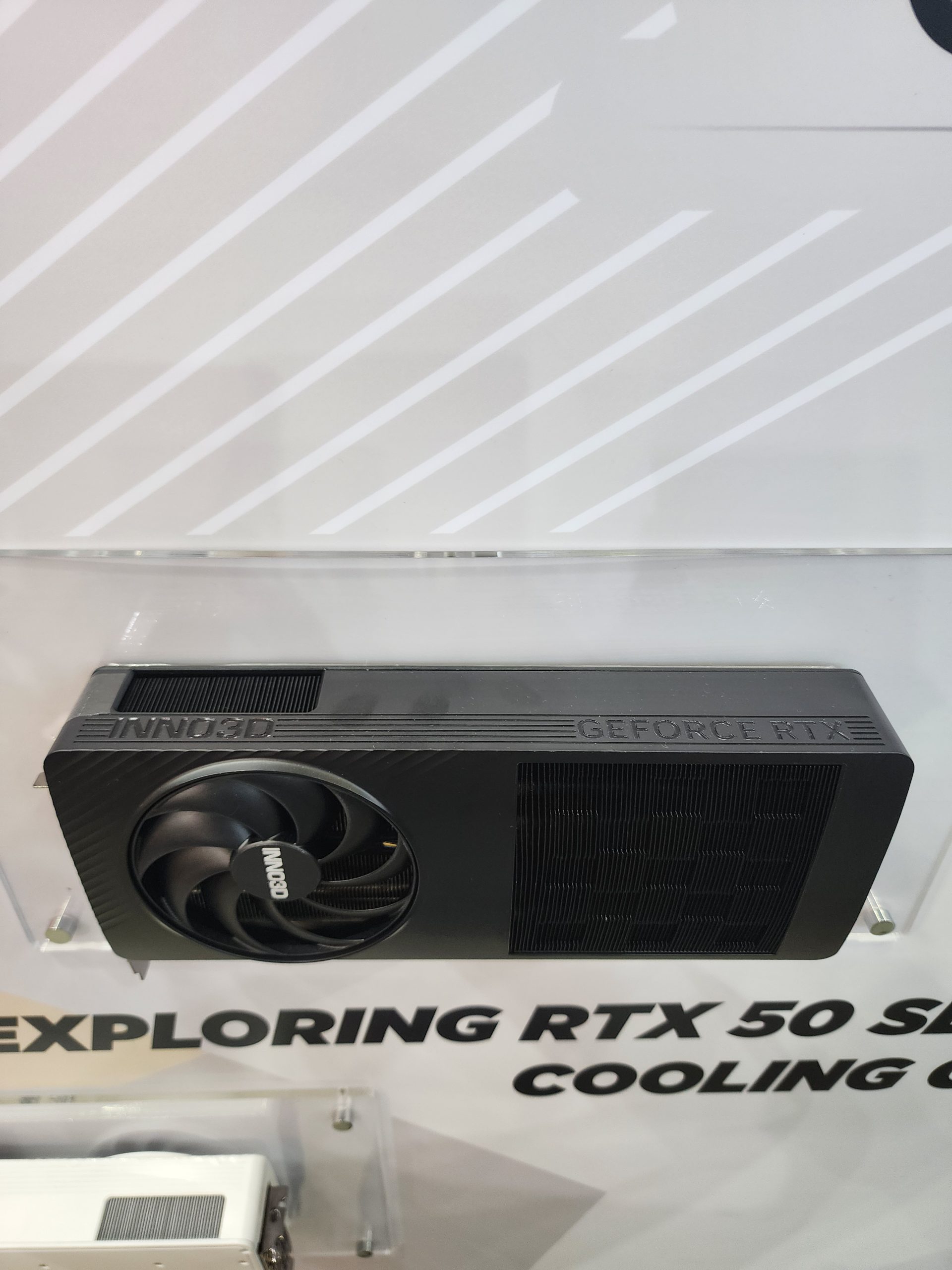 An Inno3D GeForce RTX graphics card is mounted on a display with visible text 'EXPLORING RTX 50 SERIES COOLING'.