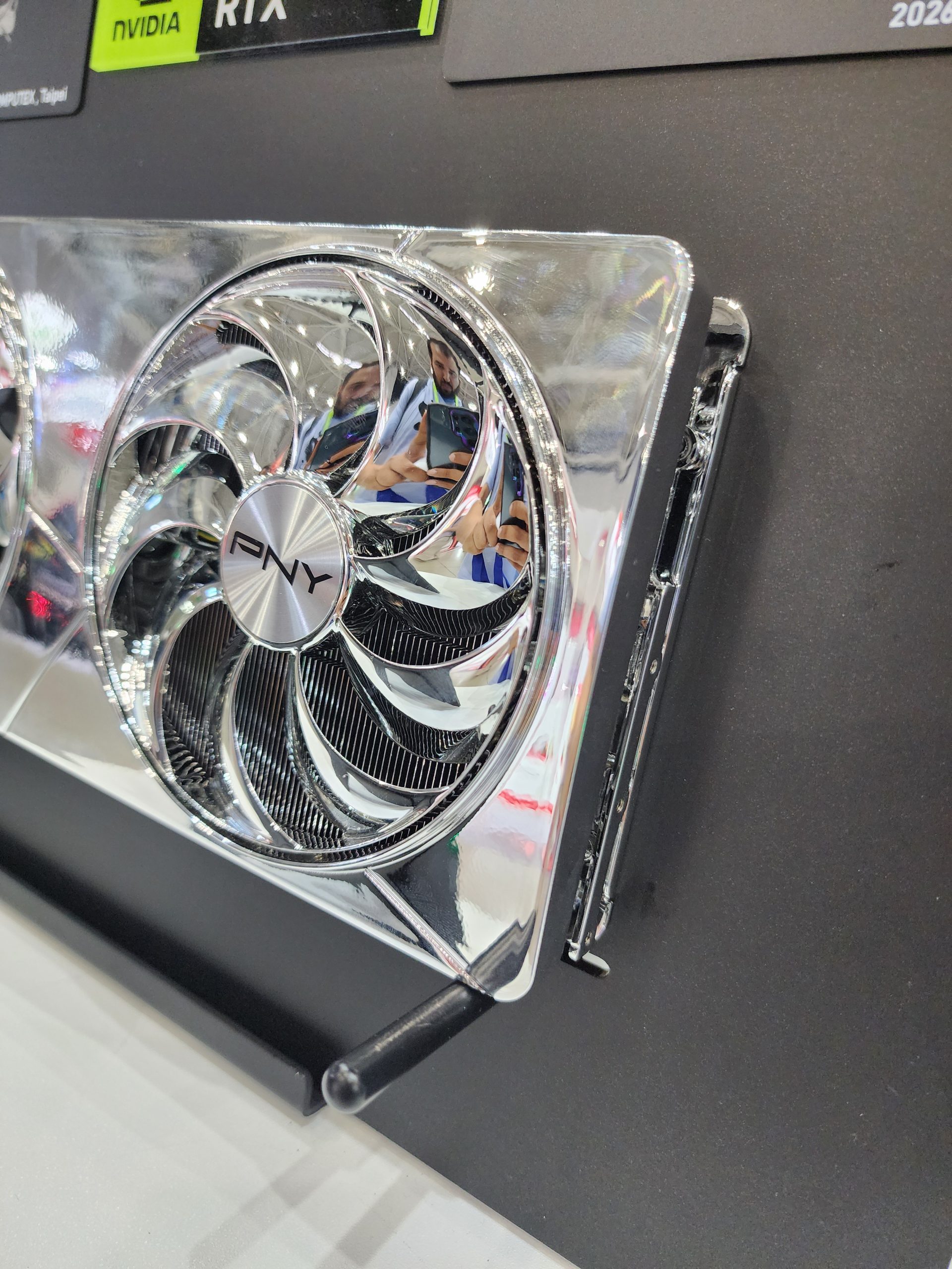 A PNY GeForce RTX graphics card with a reflective silver design is displayed at Computex, Taipei.