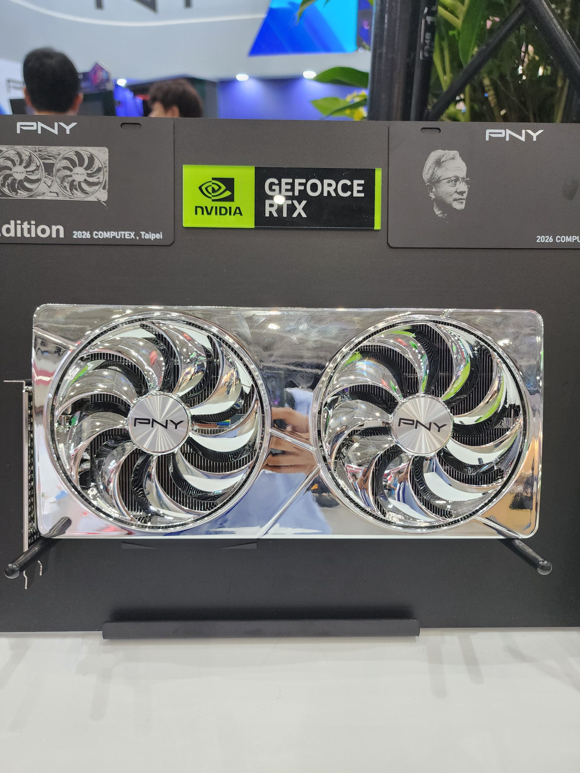 A PNY graphics card featuring dual fans is displayed with 'NVIDIA GeForce RTX' branding at Computex 2026, Taipei.