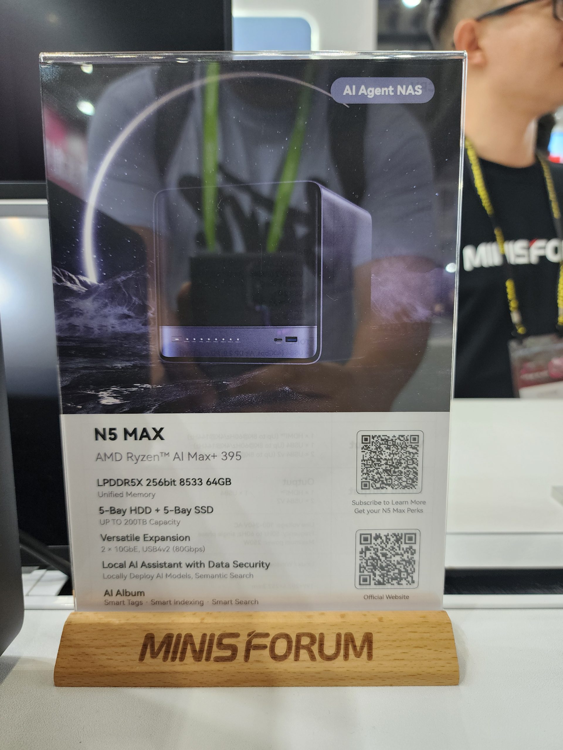 An information stand displays the MINISFORUM N5 Max featuring 'AMD Ryzen AI Max 395,' 'LPDDR5X 256bit 8533 64GB,’ with a '5-Bay HDD + 5-Bay SSD' configuration.