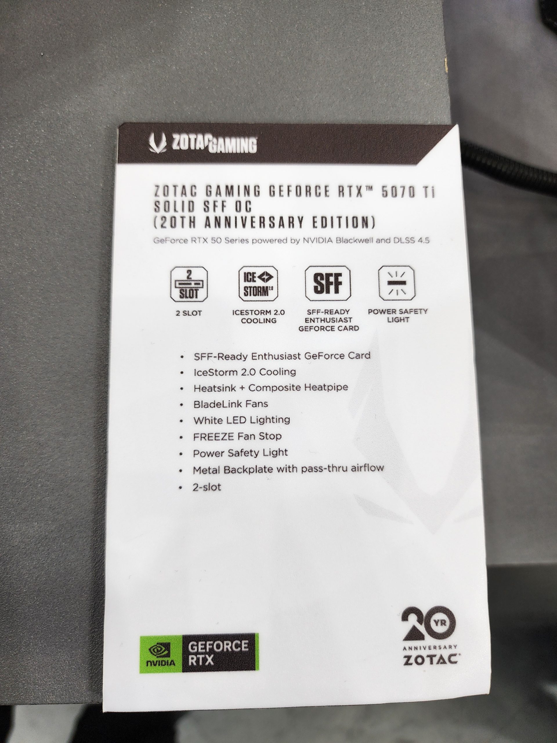 The image shows a label for the Zotac Gaming GeForce RTX 5070 Ti Solid SFF OC, 20th Anniversary Edition, featuring '2 Slot,' 'IceStorm 2.0,' and 'SFF-Ready Enthusiast GeForce Card,' with NVIDIA GeForce RTX and 20th Anniversary Zotac logos.