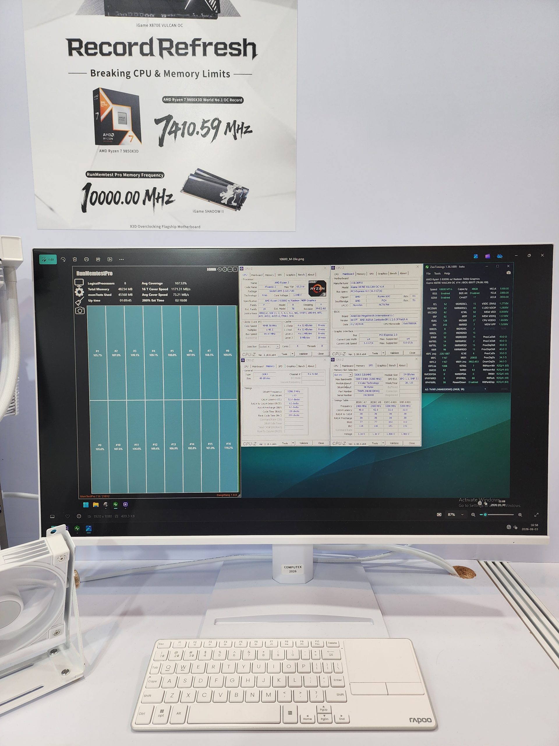 A computer monitor displays detailed system information and benchmarks alongside a poster promoting the AMD Ryzen 7 7800X3D achieving '7410.59 MHz' and an iGame SHADOW II memory reaching '10000.00 MHz'.