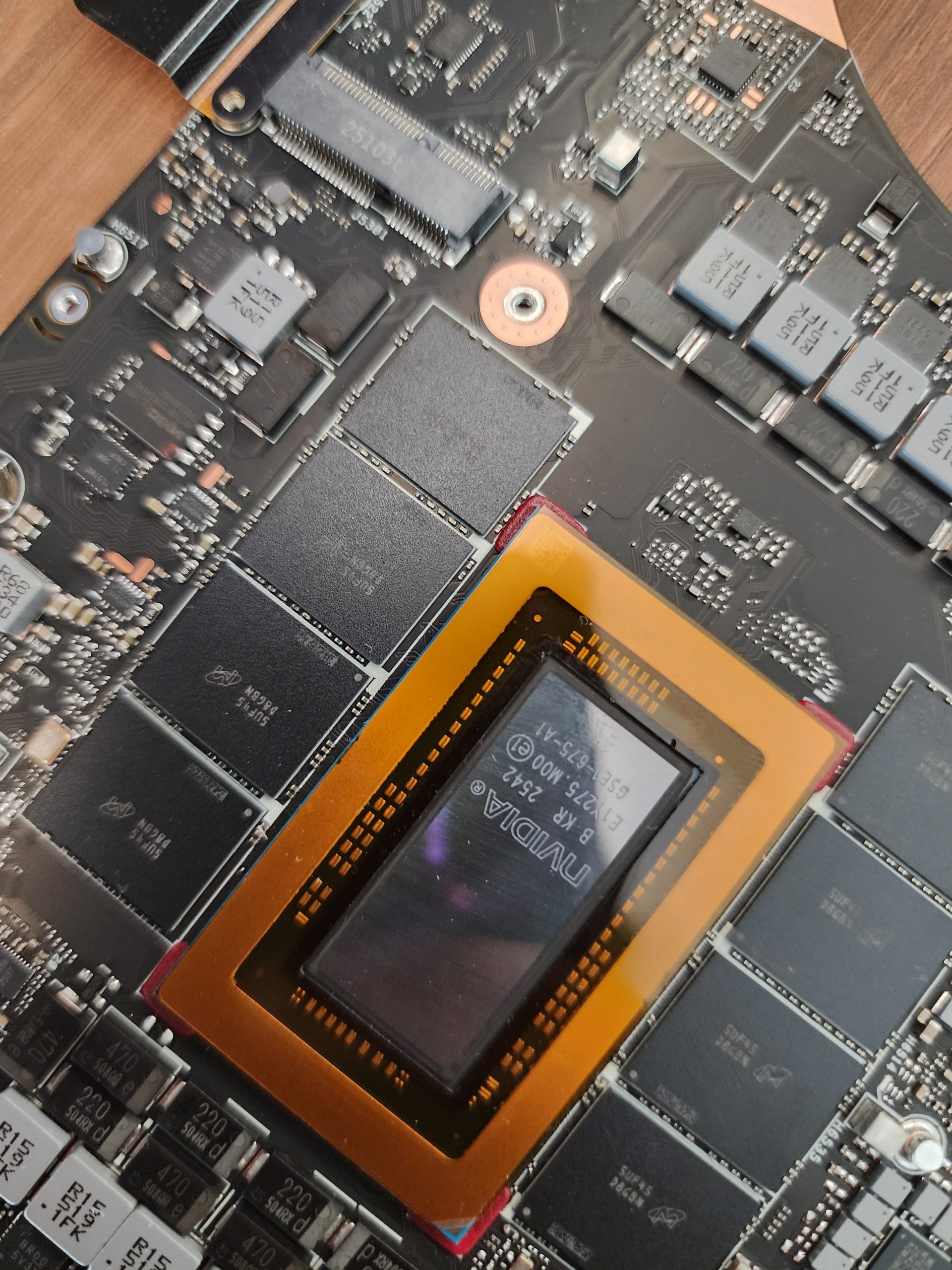A close-up of an NVIDIA chip labeled 'GK-BSP-452A' on a circuit board, surrounded by various other electronic components.