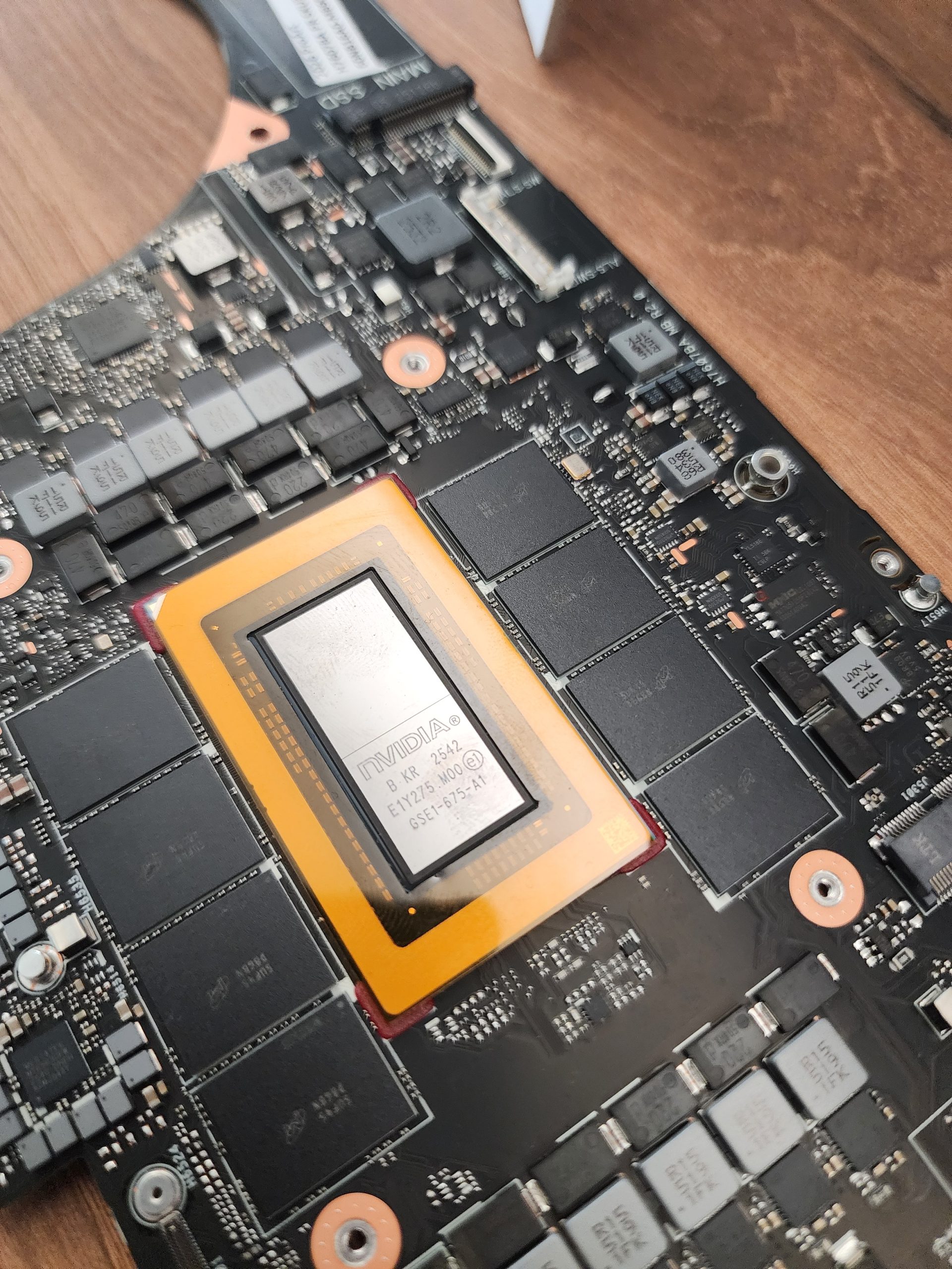 A NVIDIA chipset labeled 'NVIDIA' and 'EY1215-1000' is mounted on a PCB with visible memory modules and connectors.