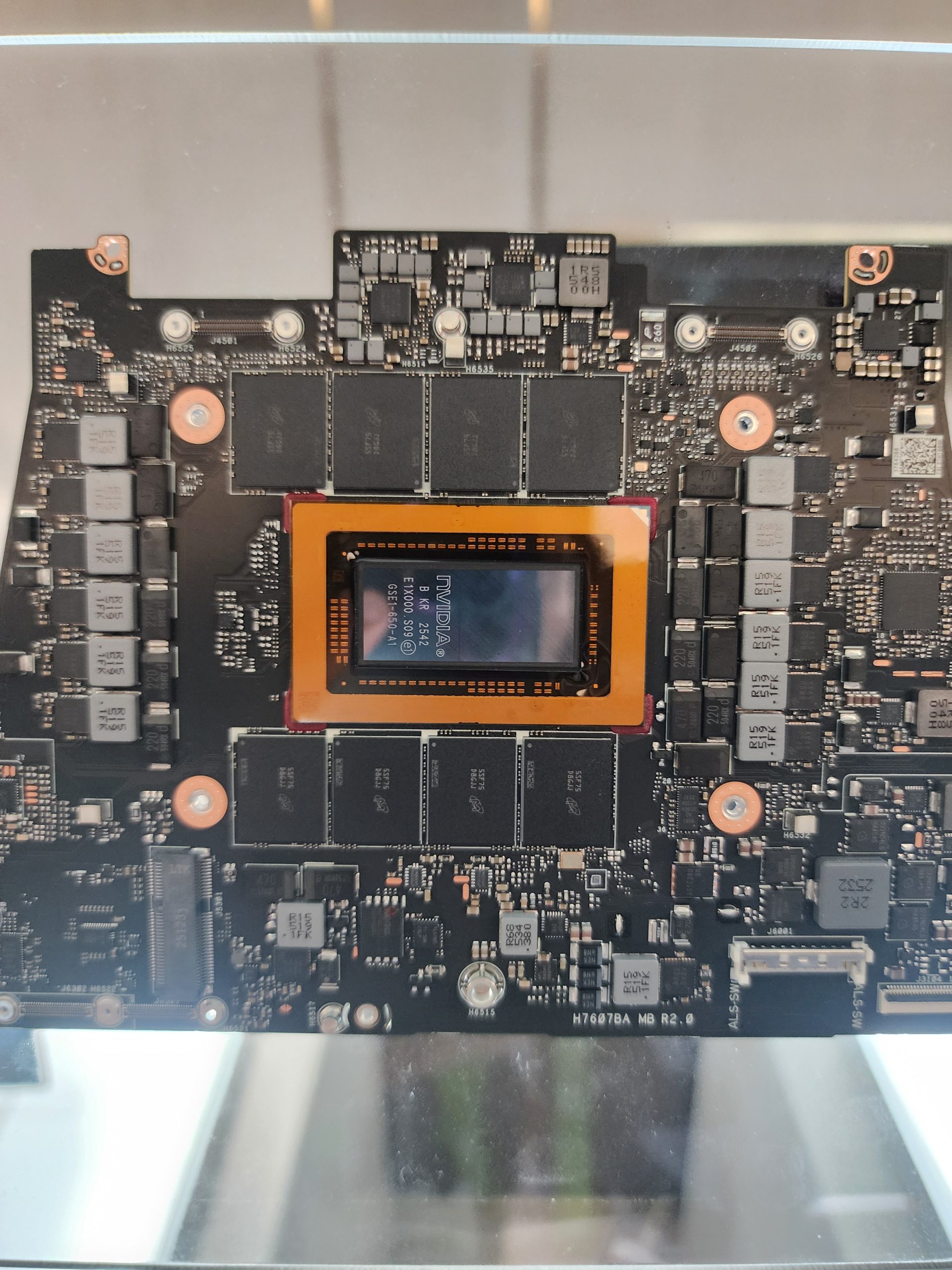 A close-up of an NVIDIA graphics card circuit board with a visible chip labeled 'NVIDIA AD106-350-A1' in the center.