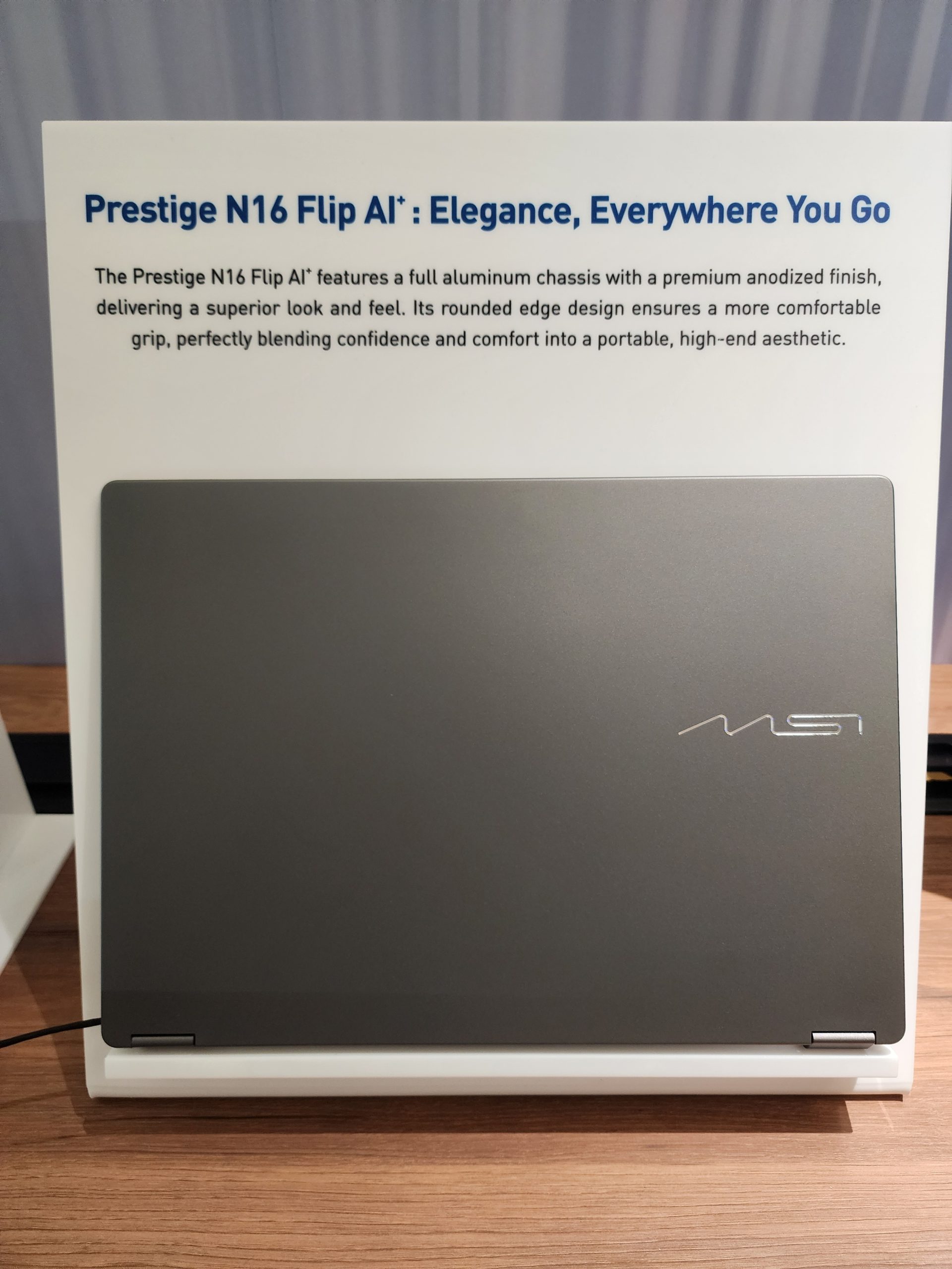 The MSI Prestige N16 Flip A13 laptop on display highlights its 'Elegance, Everywhere You Go.'